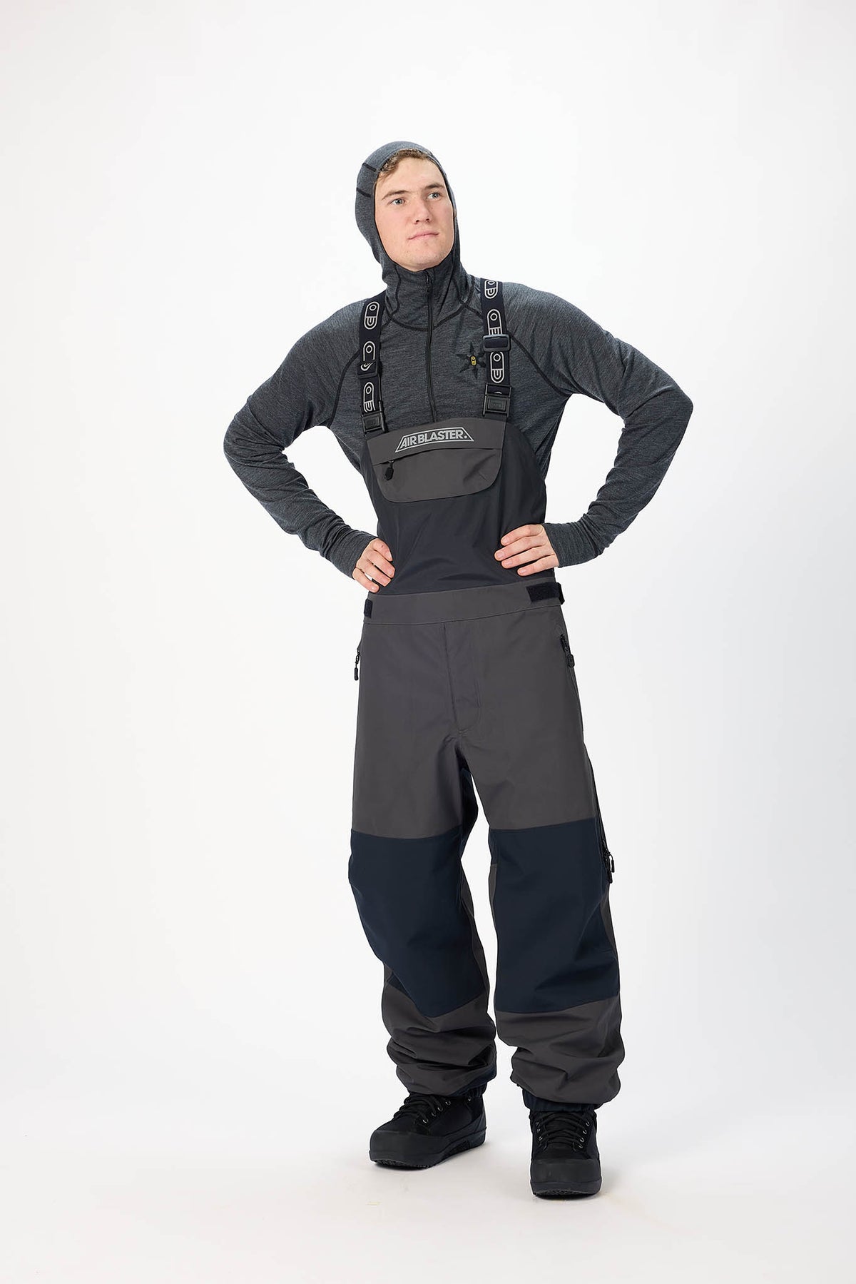 Person wearing a full-body wetsuit with a hood on a white background