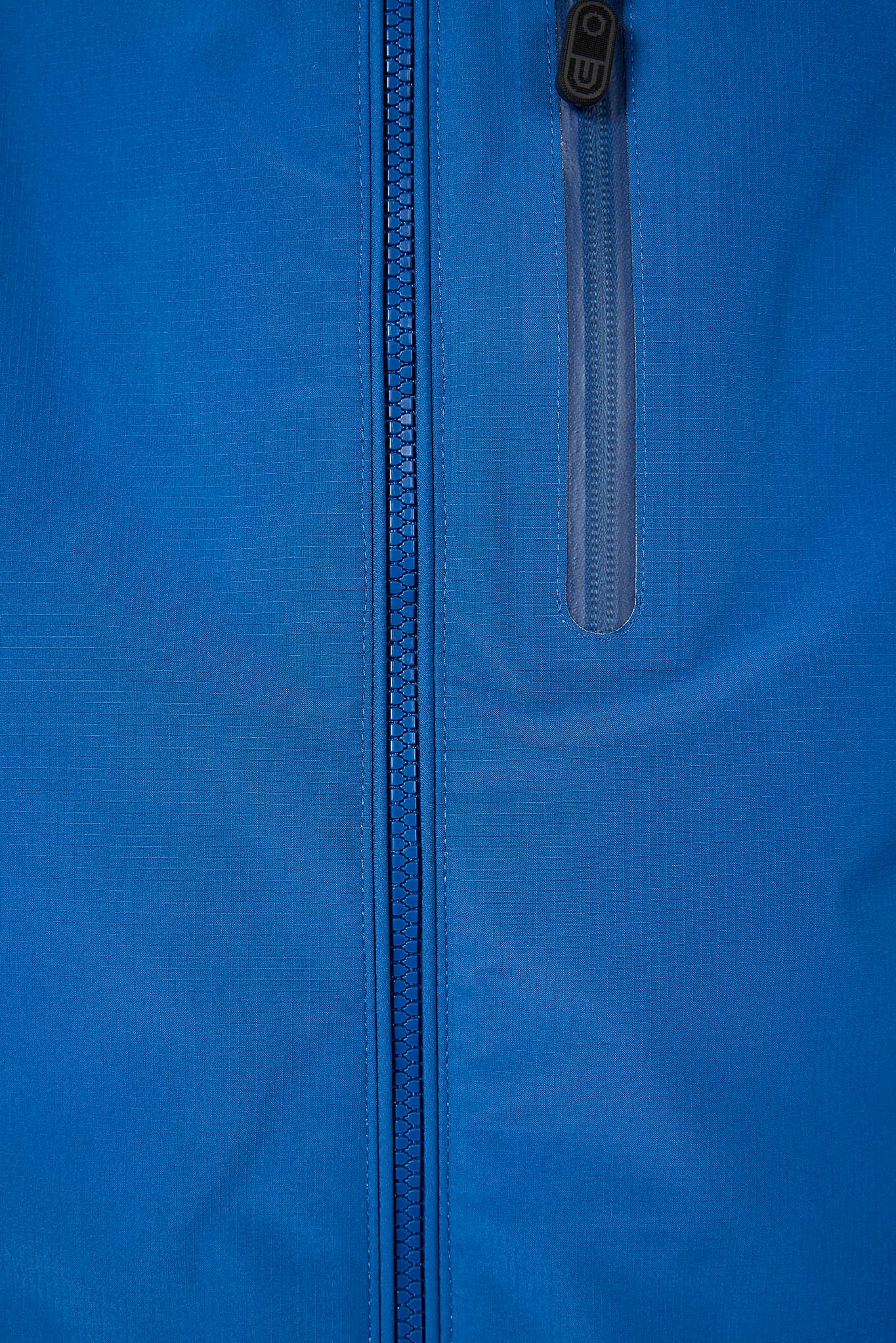 Close-up of a blue jacket with a zipper