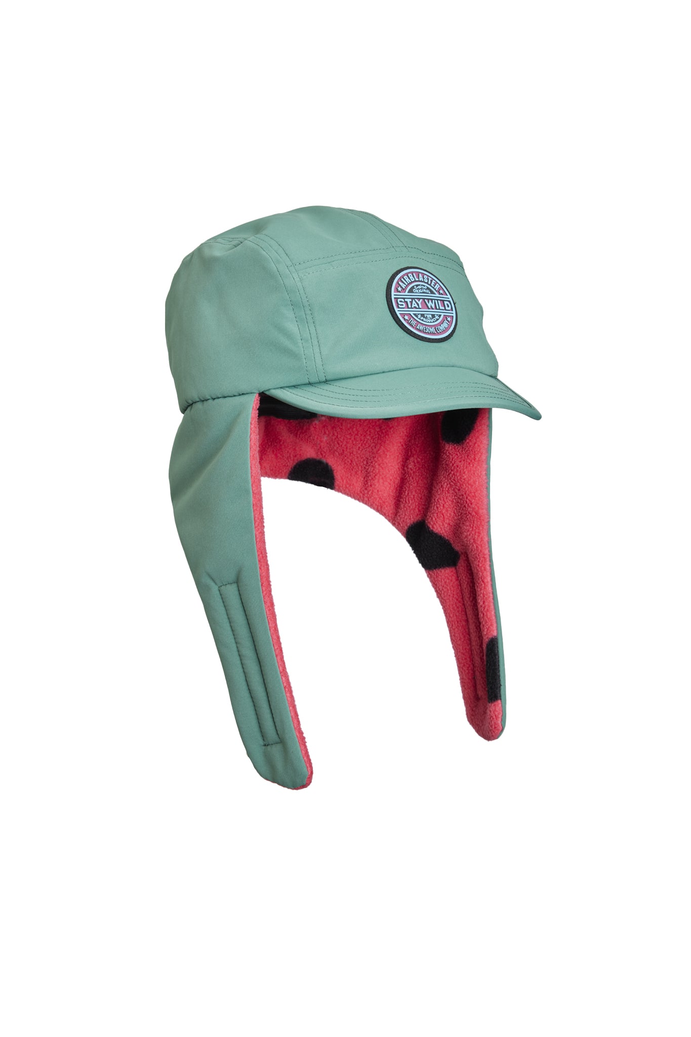 A mint green winter trapper hat with a pink fleece ear flaps lining and black polka dots, featuring a circular embroidered logo patch on the side.