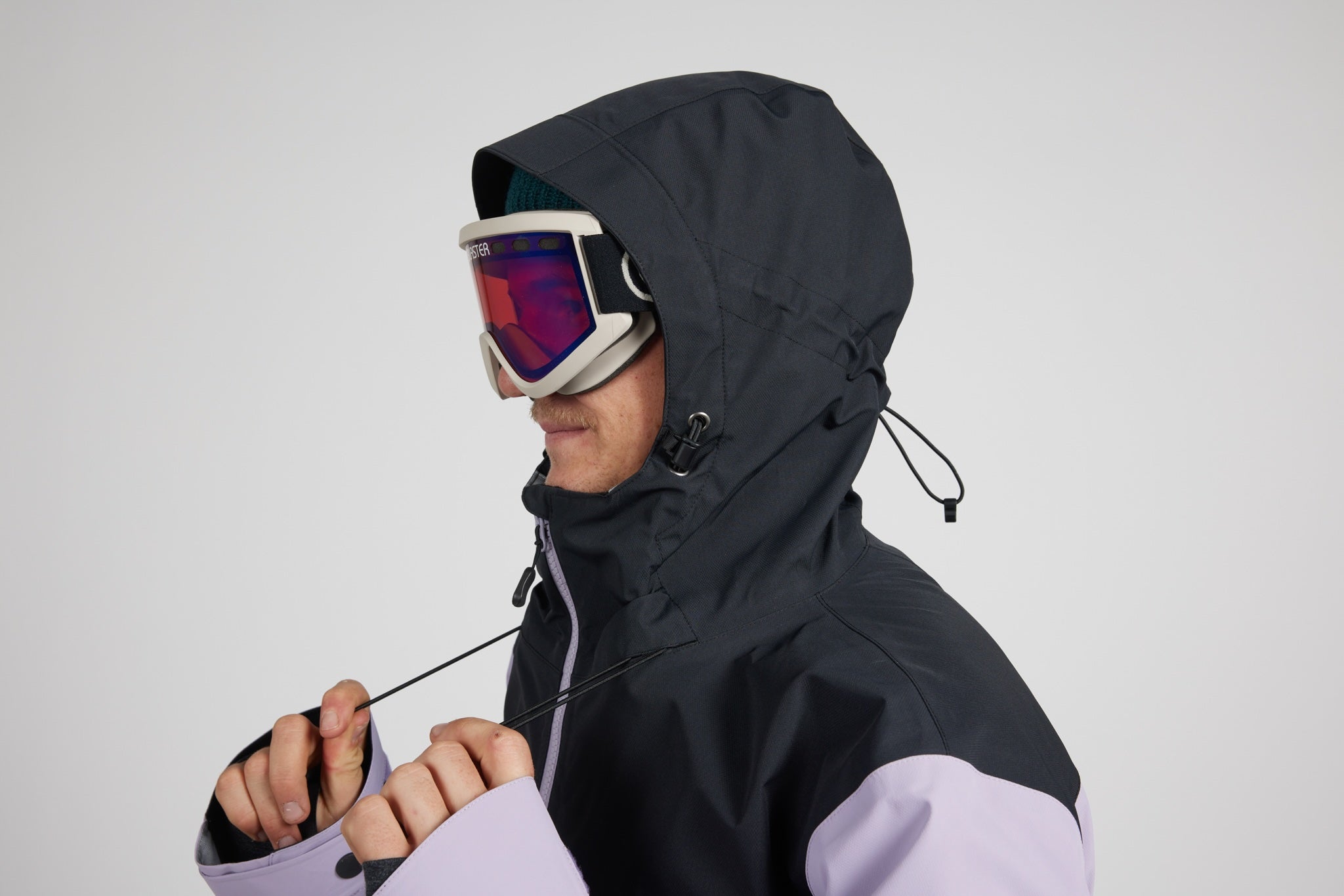 drawl cord being pulled on jacket with a white background