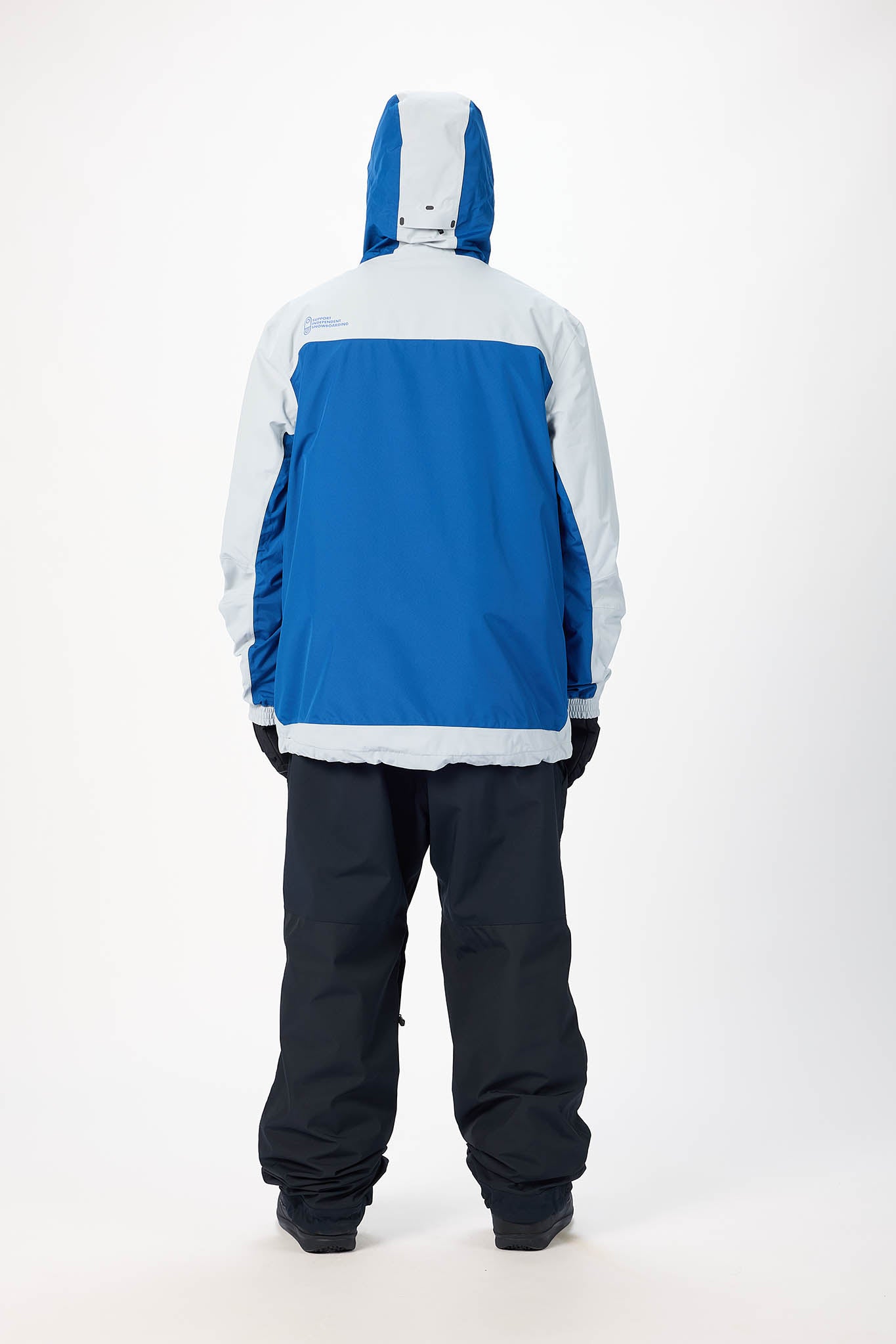 Blue and white jacket with black pants on a white background
