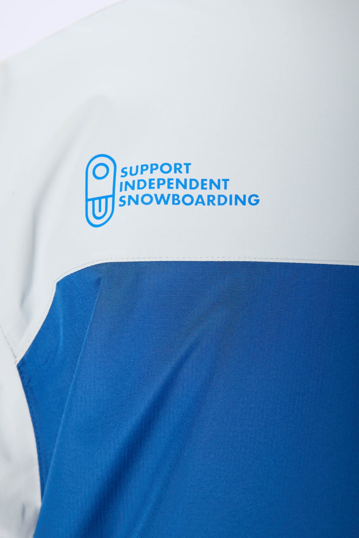 close up of navy
jacket and air blaster logo