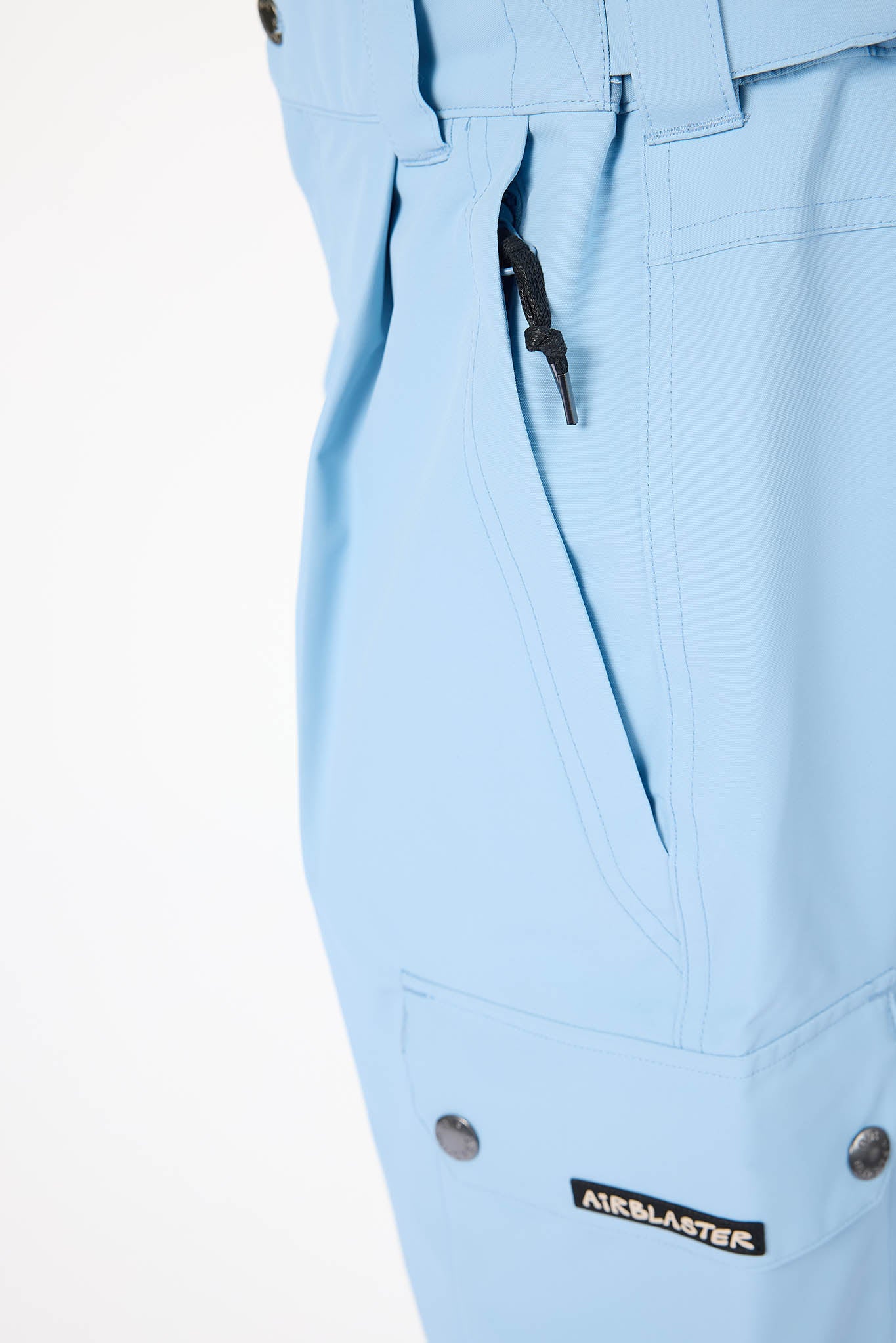 Light blue pants with a brand label on a white background