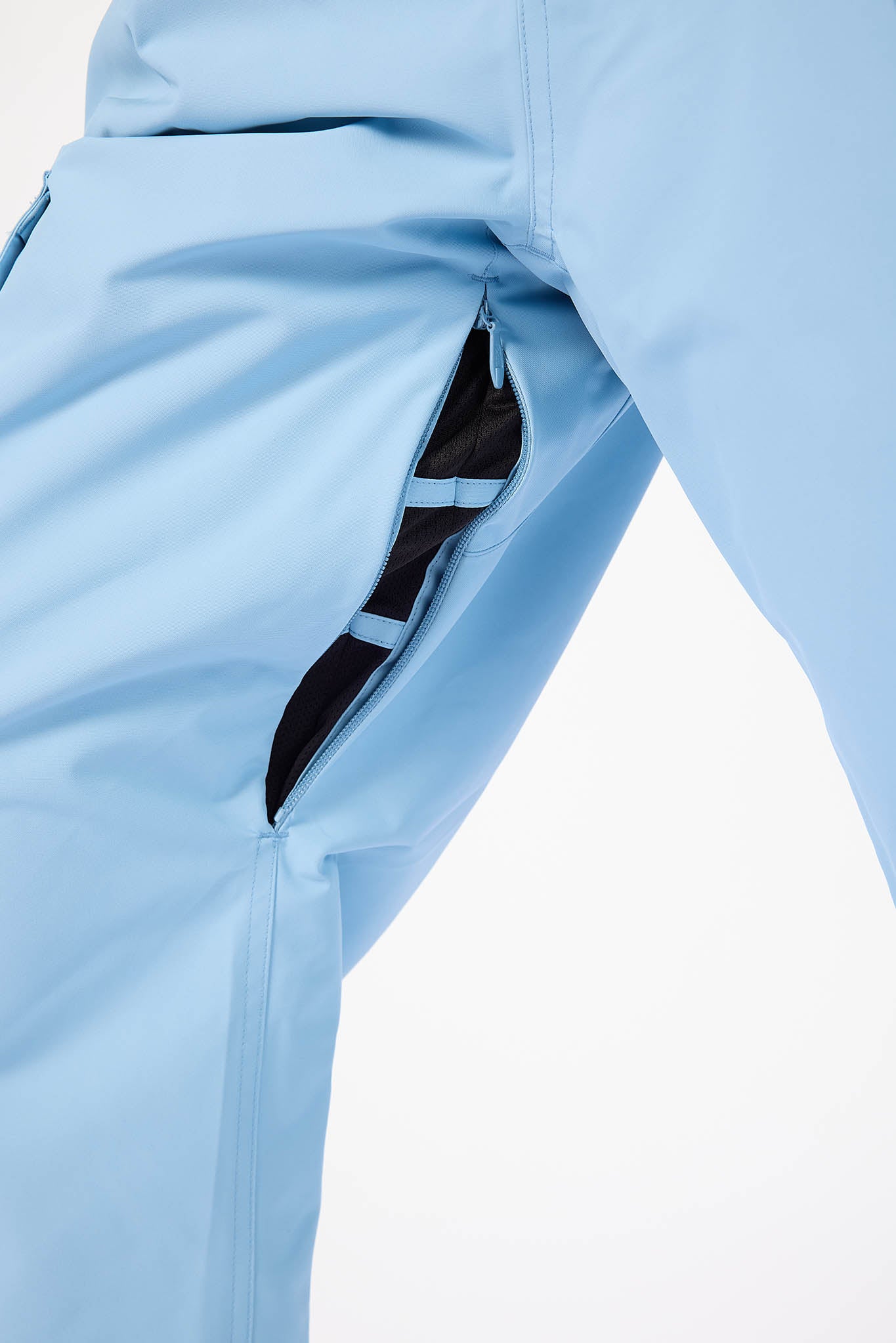 Light blue jacket with a zipper pocket on a white background