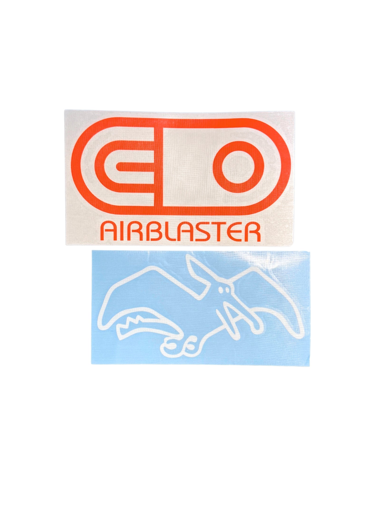 Two rectangular decals on a white background: the top decal is off-white with a bold orange 'AirPill' logo and the word 'AIRBLASTER' in orange; the bottom decal is light blue with a white outlined bird graphic.