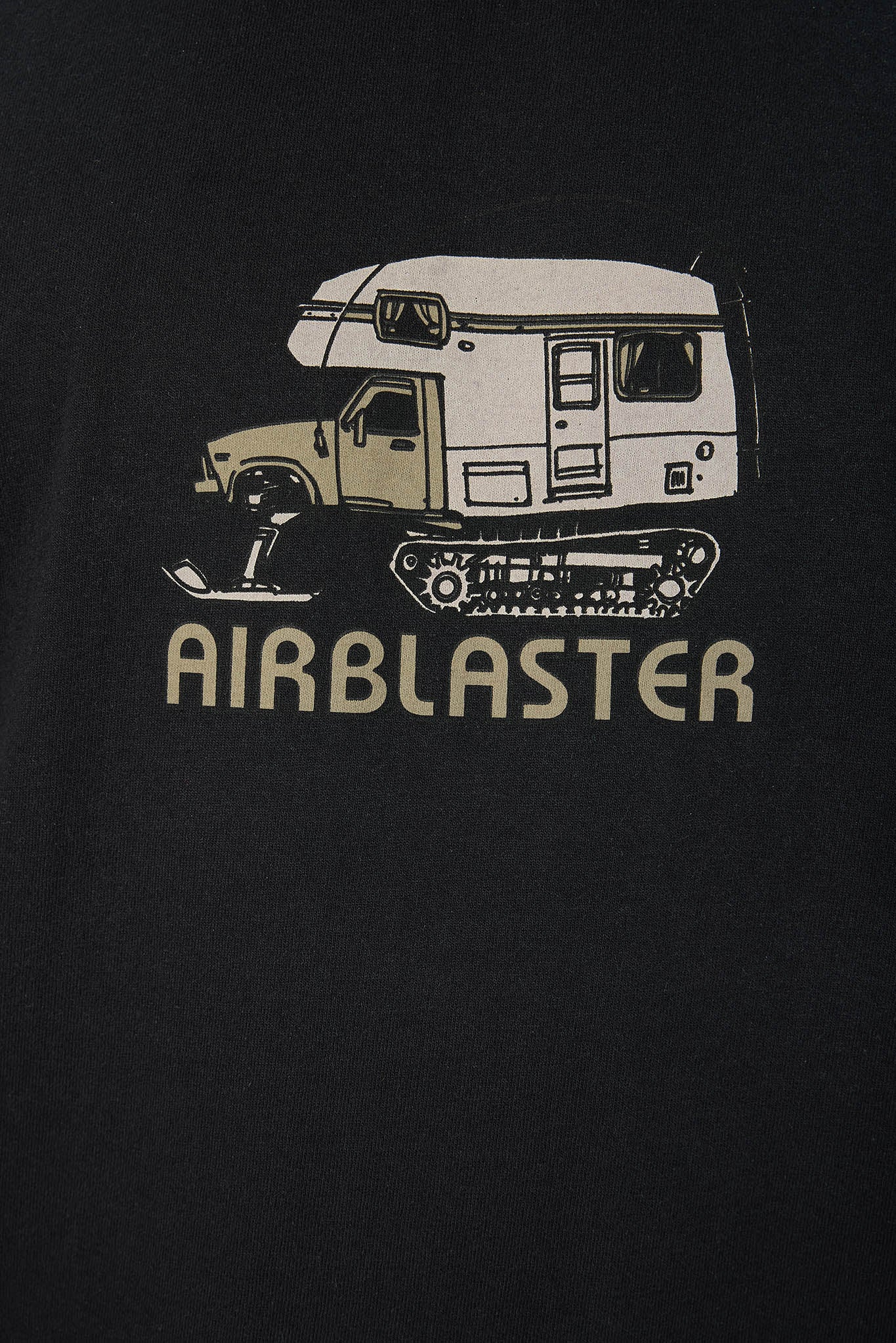 Close-up of a black T-shirt or dark fabric featuring a graphic of a snowmobile camper with the word 'AIRBLASTER' printed below in a light beige color.
