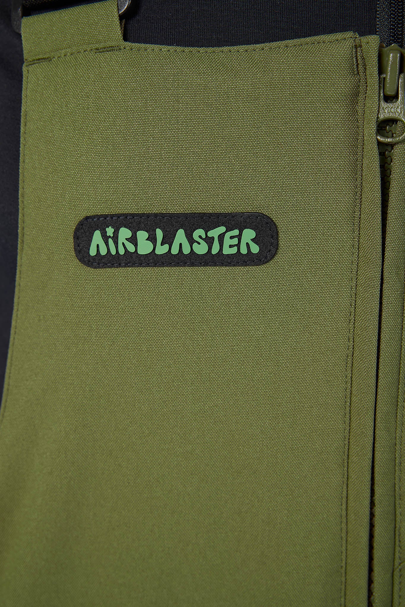 Green bag with 'Airblaster' logo on a black background
