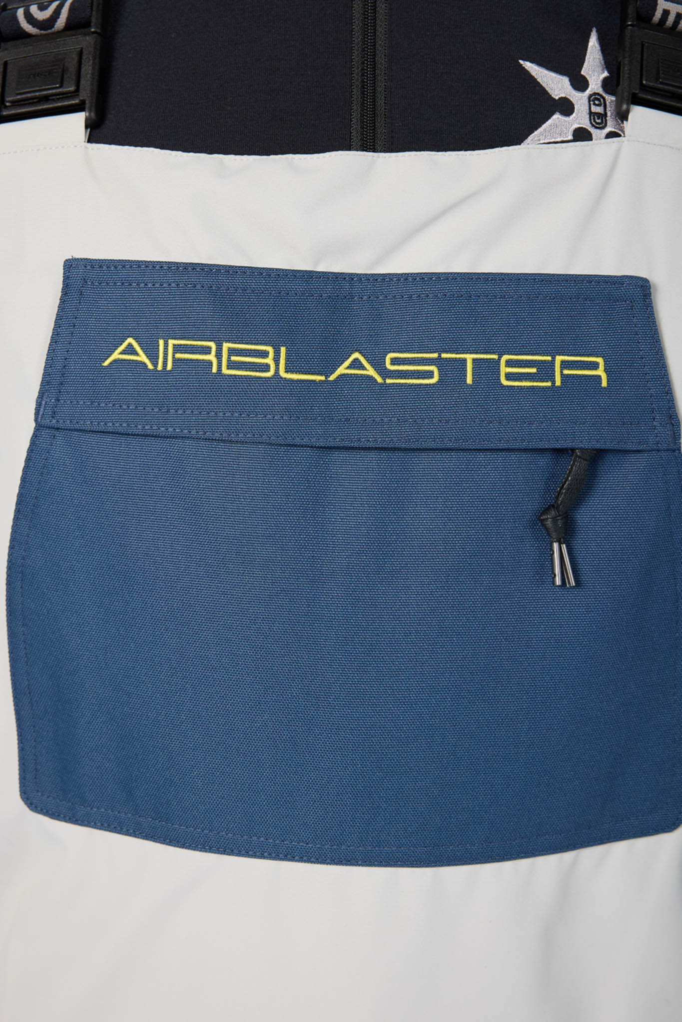 Blue pocket with 'AIRBLASTER' branding on a white and black background