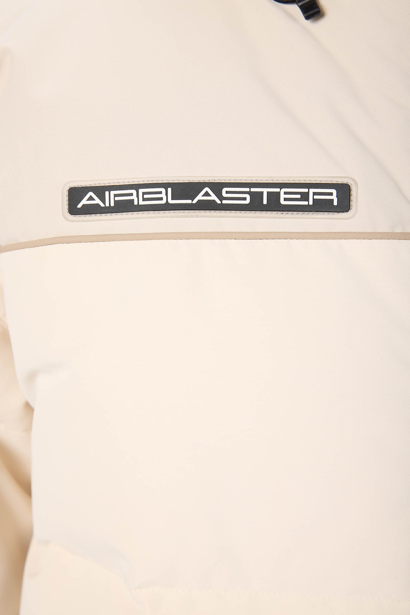 Beige jacket with 'AIRBLASTER' logo on a white background