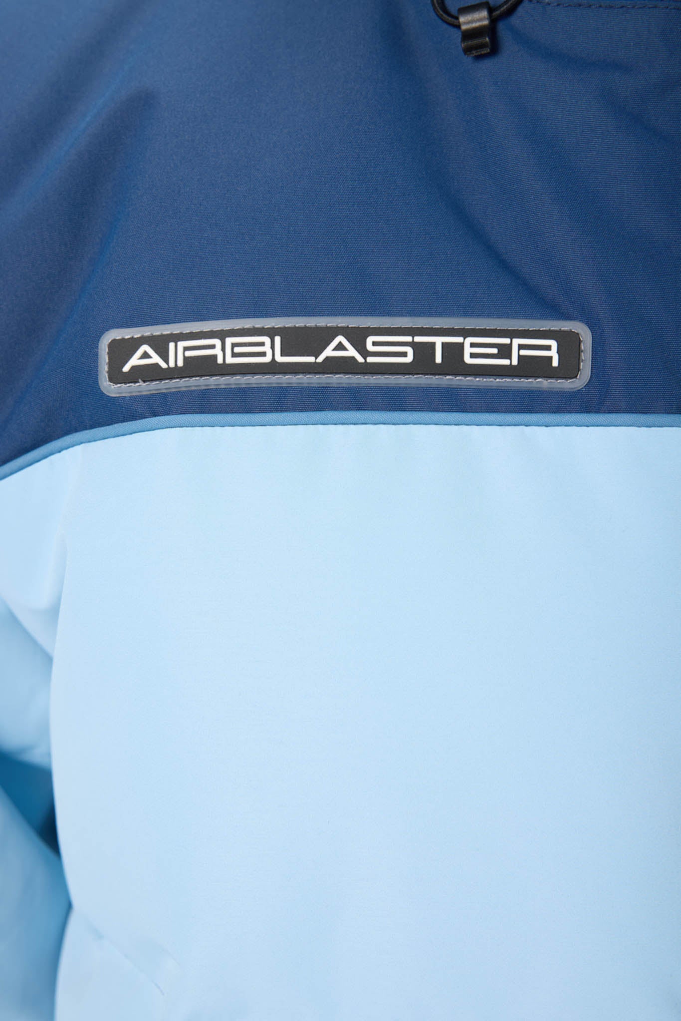 Close-up of a blue jacket with 'Airblaster' logo