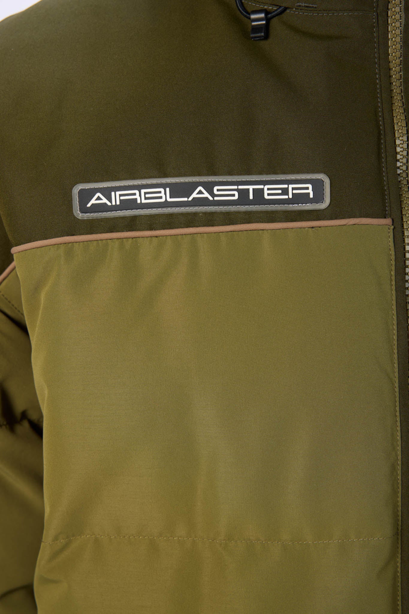 Close-up of a green jacket with 'AIRBLASTER' logo on the chest.