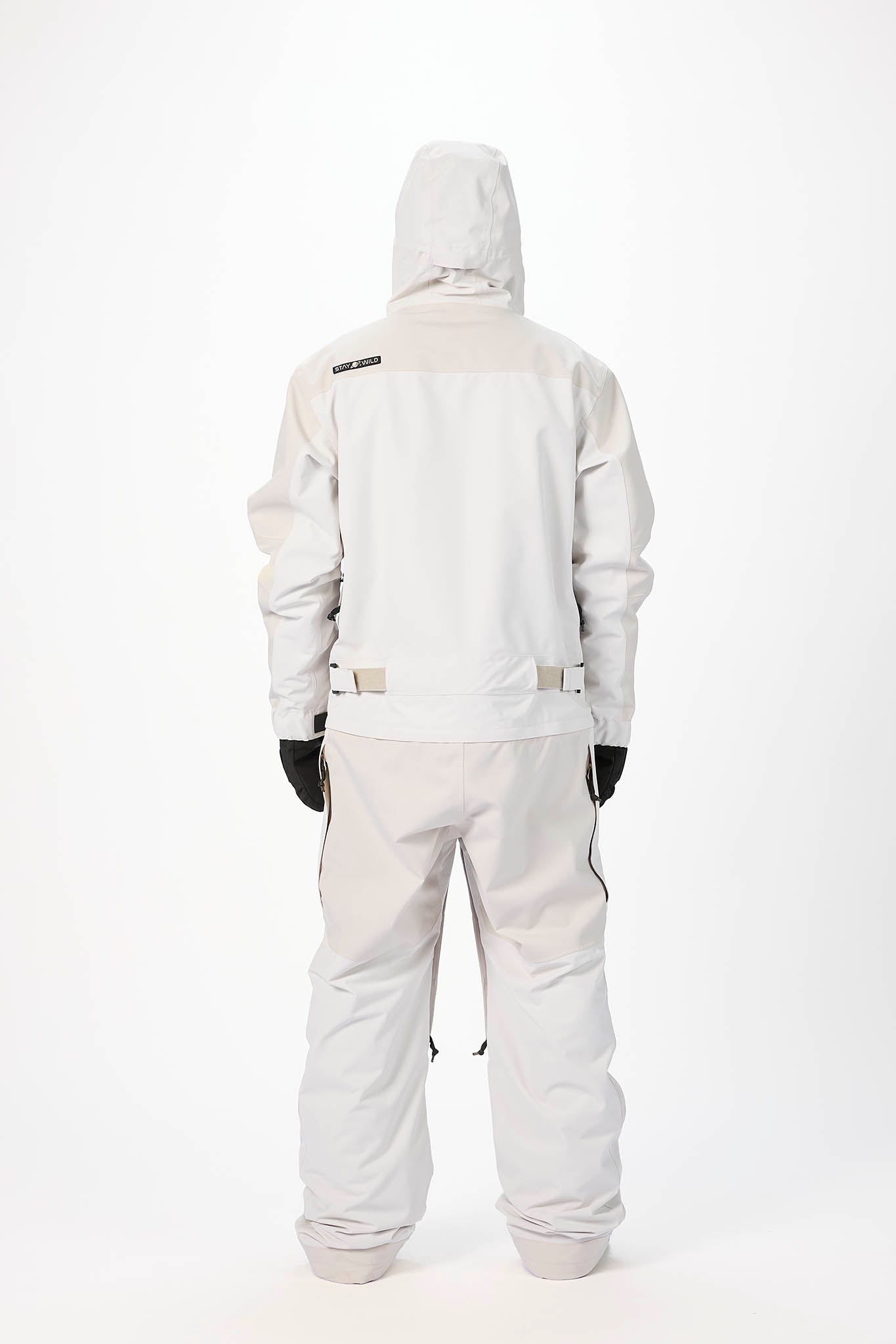 White snowsuit with black gloves on a white background