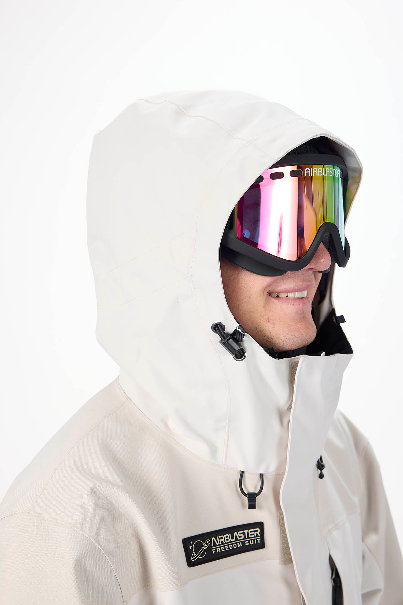 Person wearing a white hooded jacket with a colorful ski goggles on a white background