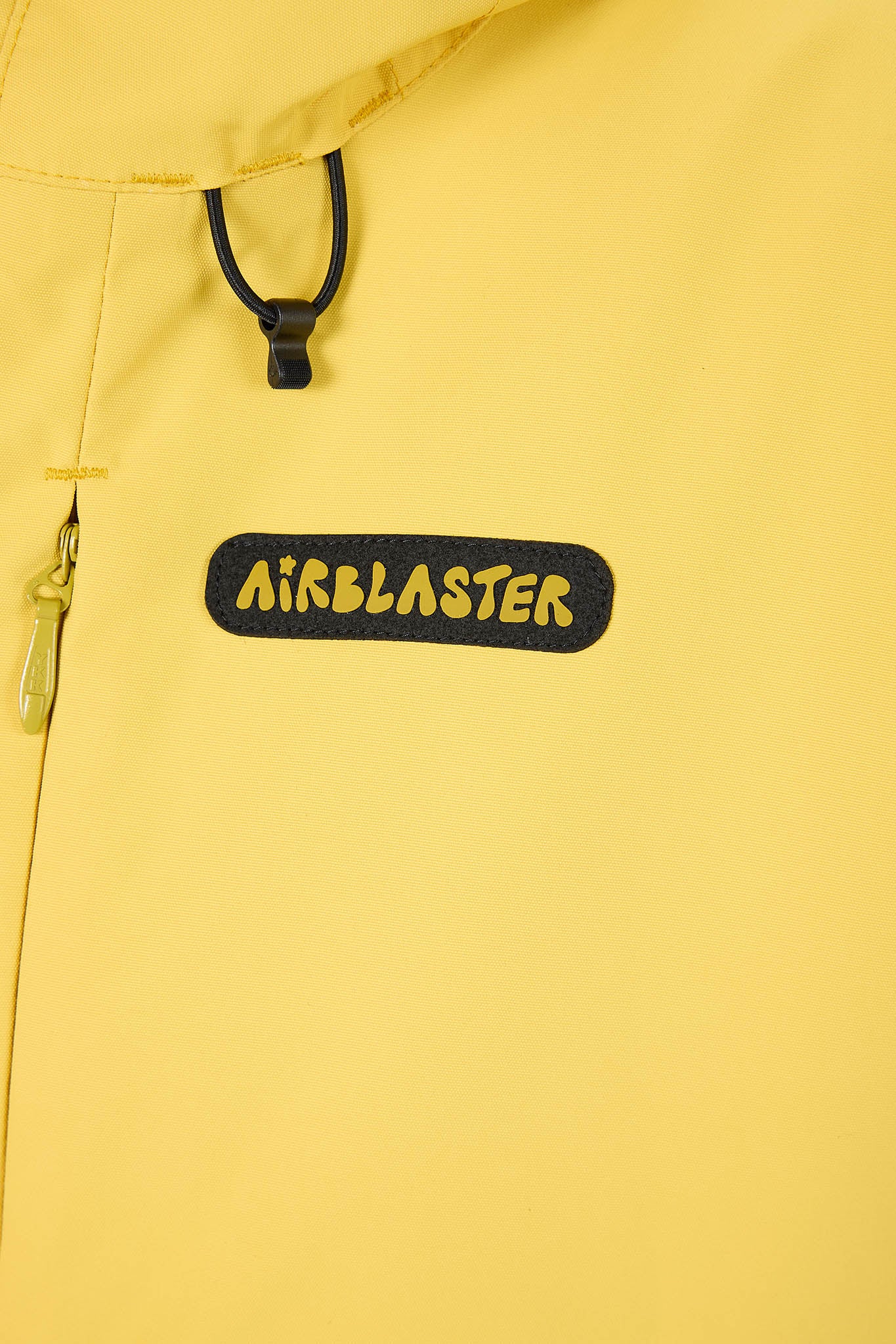 Close-up of a yellow jacket with 'Airblaster' logo