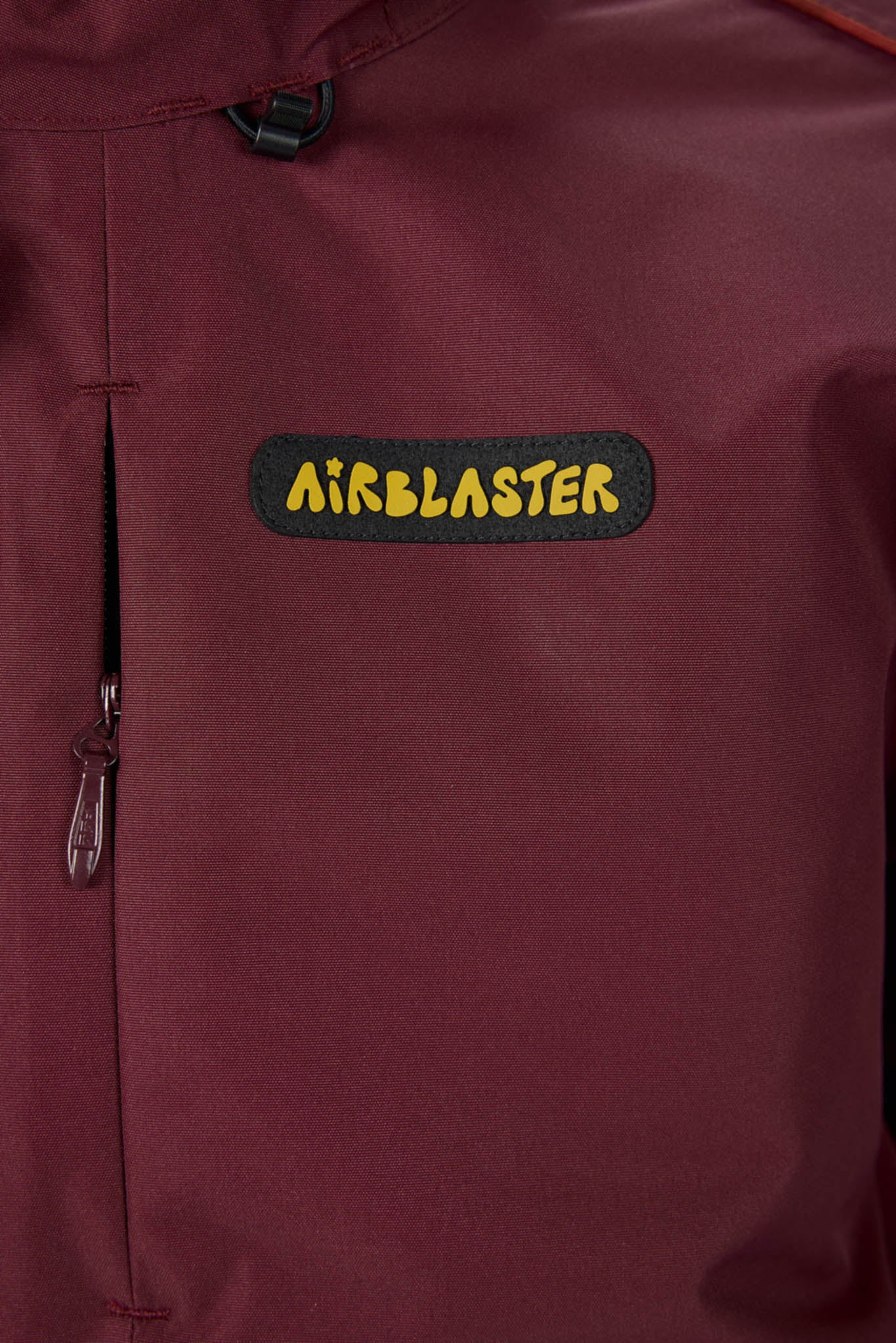 Maroon jacket with Airblaster logo patch