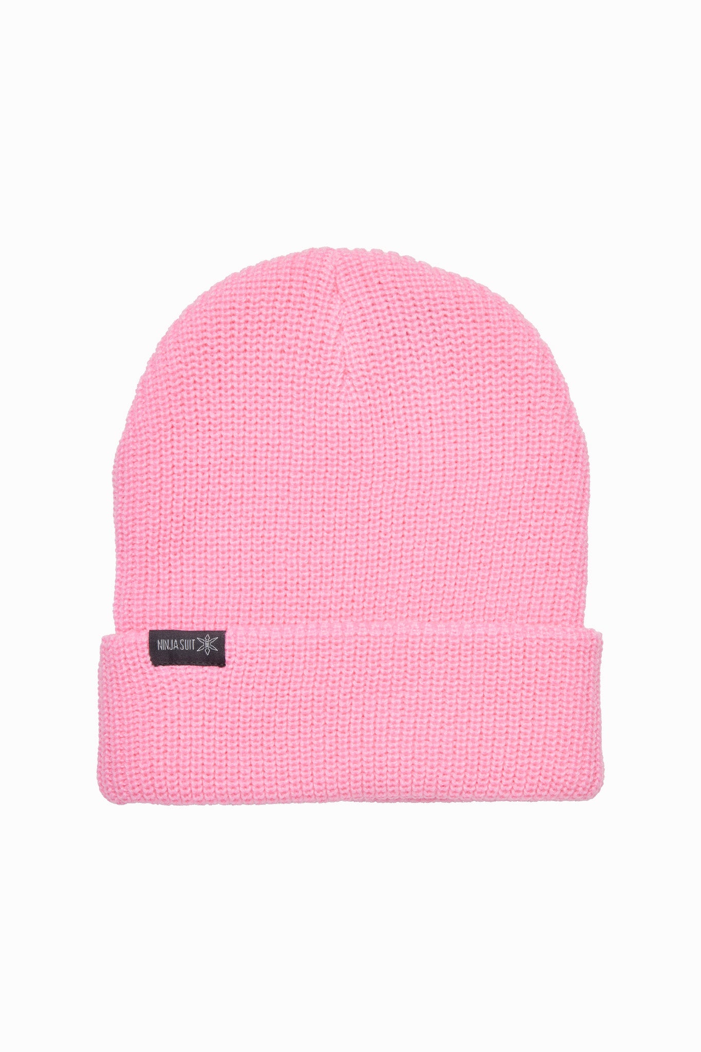 A light pink knit beanie hat with a folded cuff and a small black brand tag on the front, shown against a plain white background.