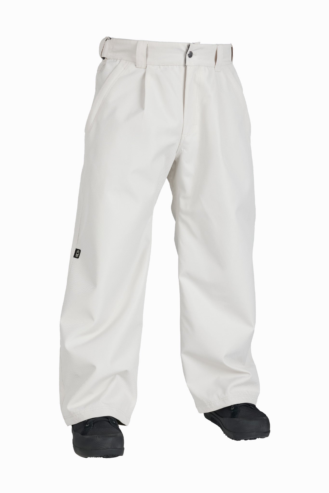 Off-white snow pants with a belt loop waist and black snow boots, shown against a plain white background.