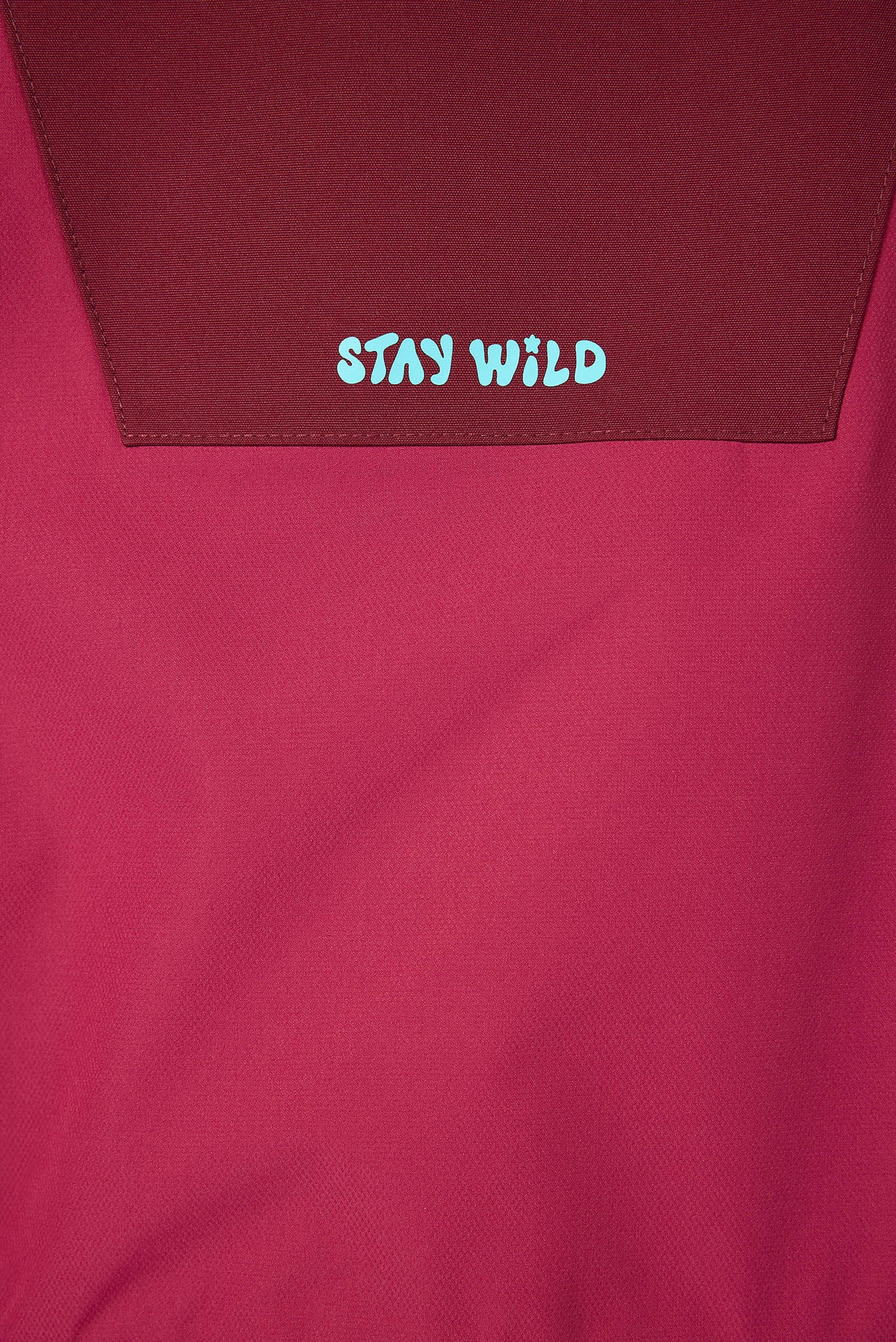 Maroon fabric with 'STAY WILD' text in white and blue.