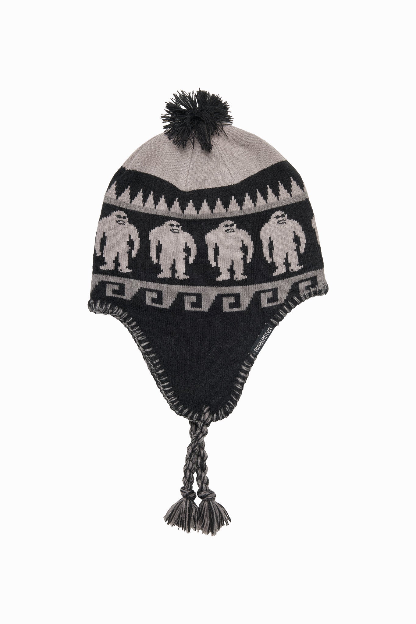 A black and gray knit pom-pom beanie with ear flaps, featuring a repeating pattern of three gray asexual figures on a black band, with a gray top panel and black pom-pom.