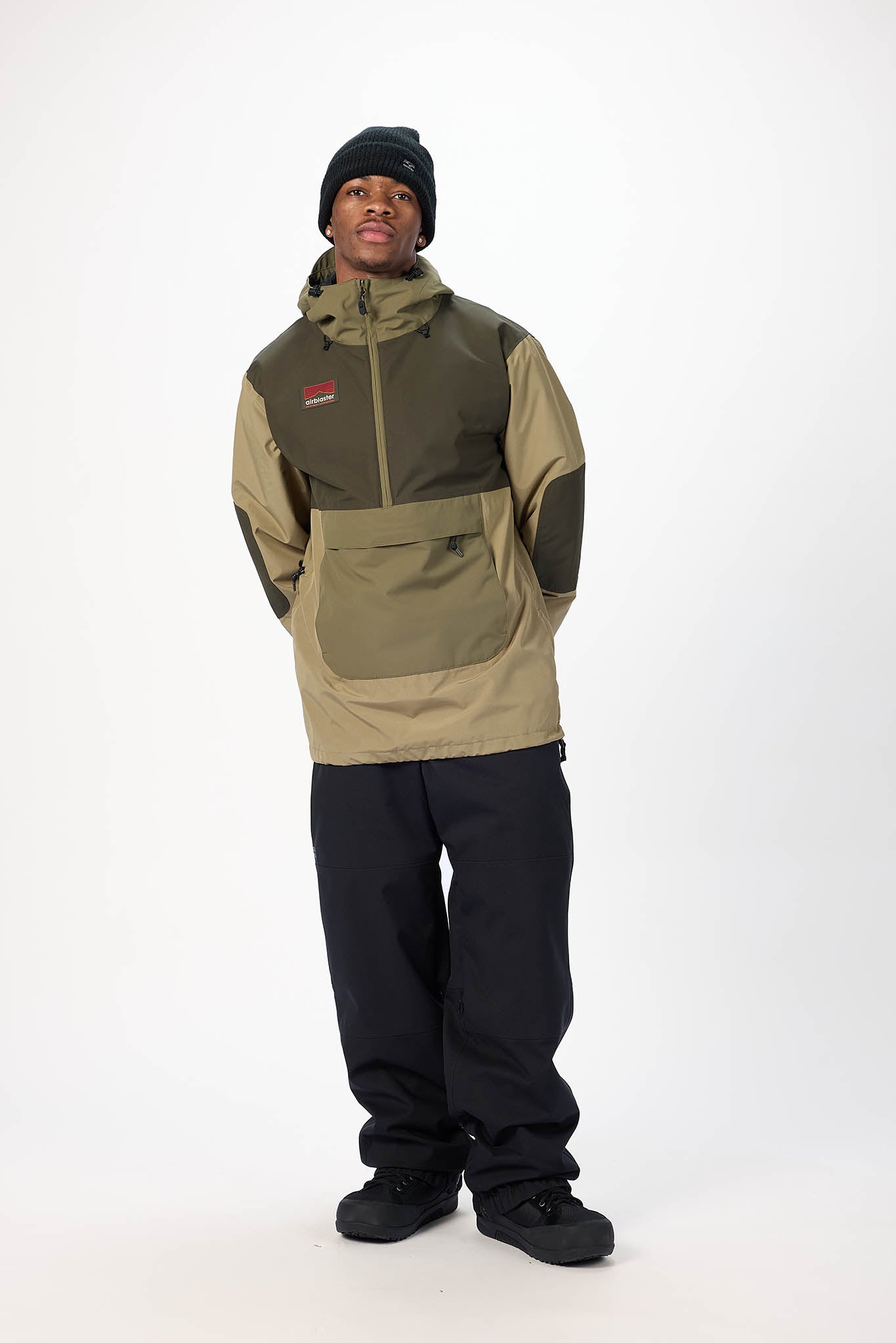 Person wearing a two-tone jacket and pants on a white background