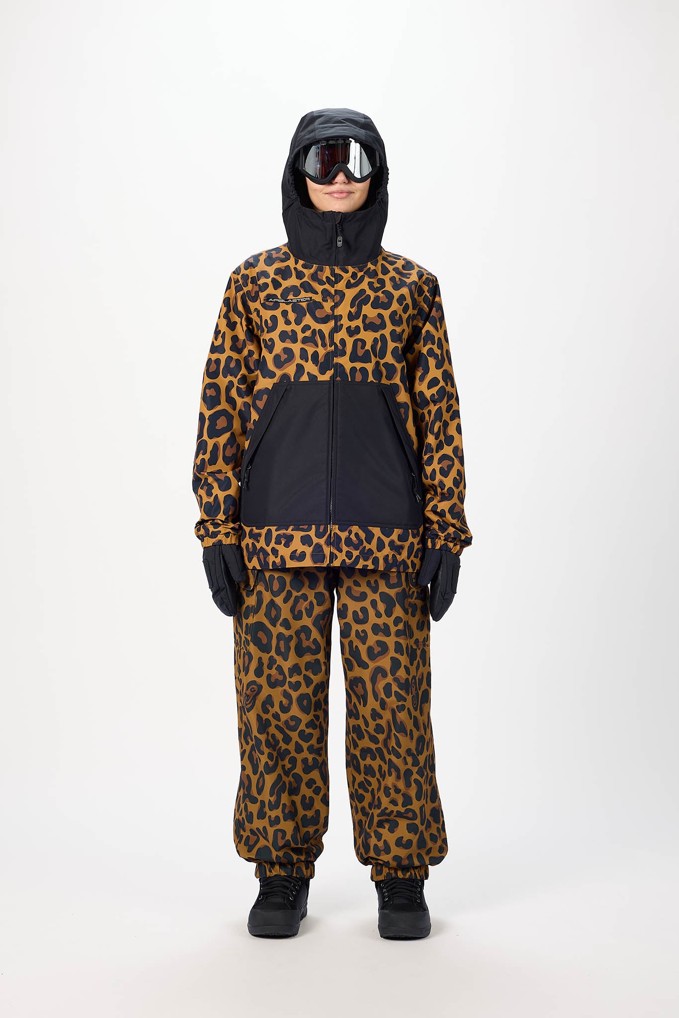 Person wearing a leopard print snowsuit on a white background