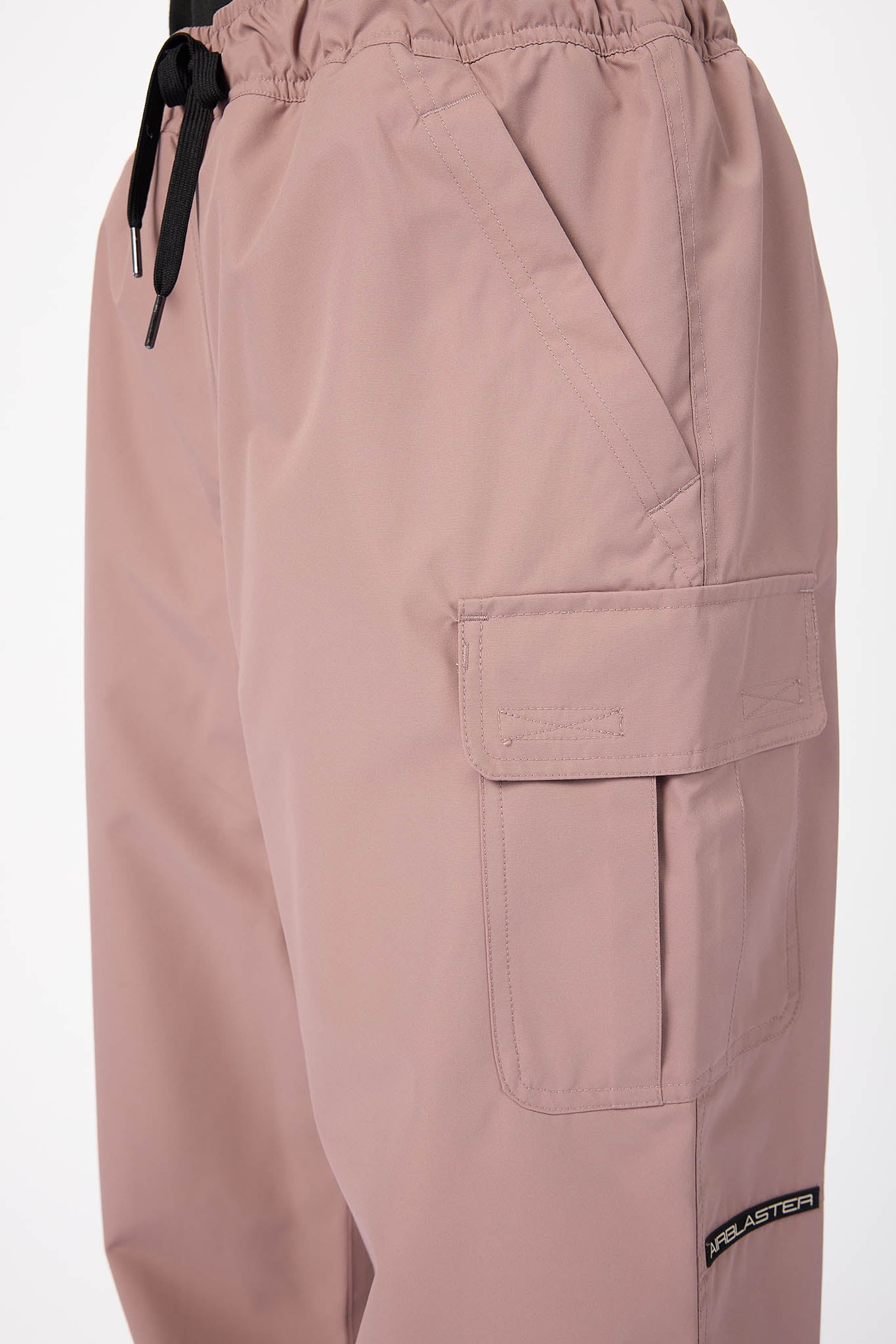 Pink cargo pants with a drawstring on a white background