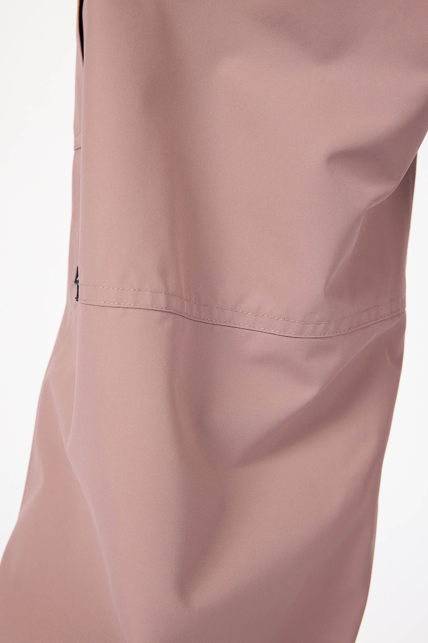 Close-up of a pink jacket with a pocket on a white background