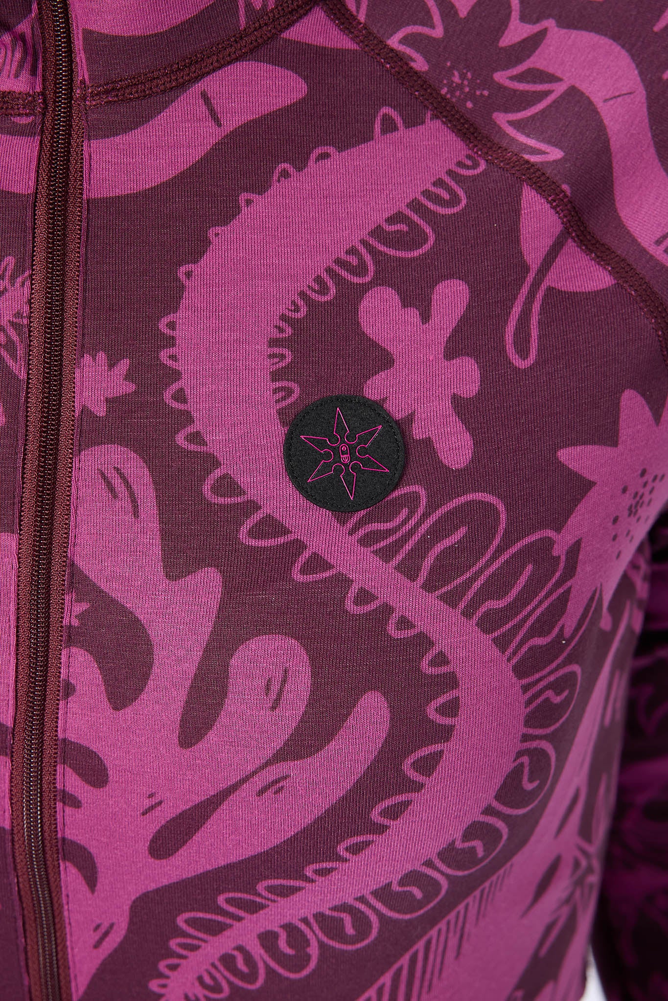 Close-up of a purple and black patterned garment with a star design on a white background