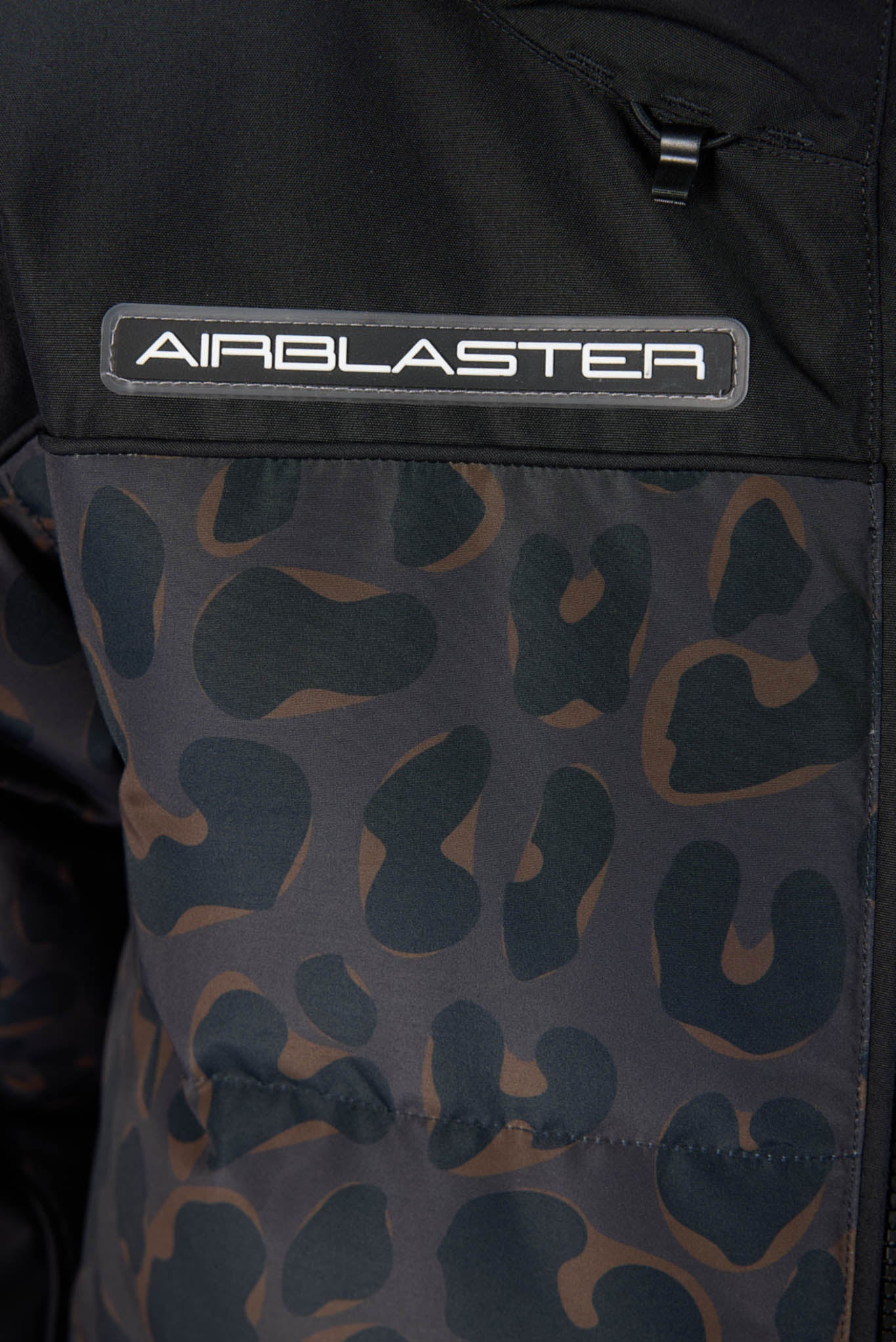 Black jacket with Airblaster logo and camouflage pattern