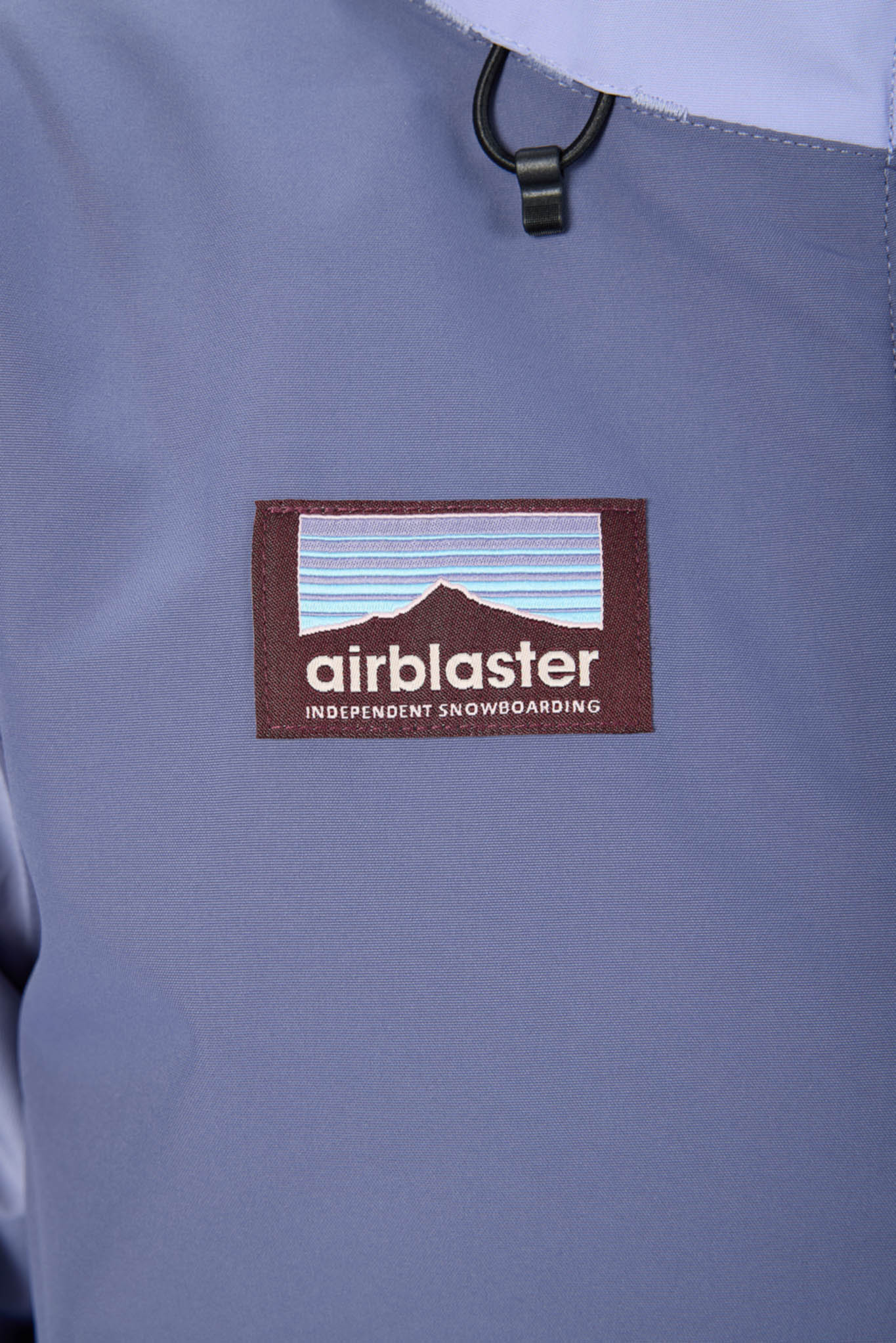 Airblaster logo on a gray jacket