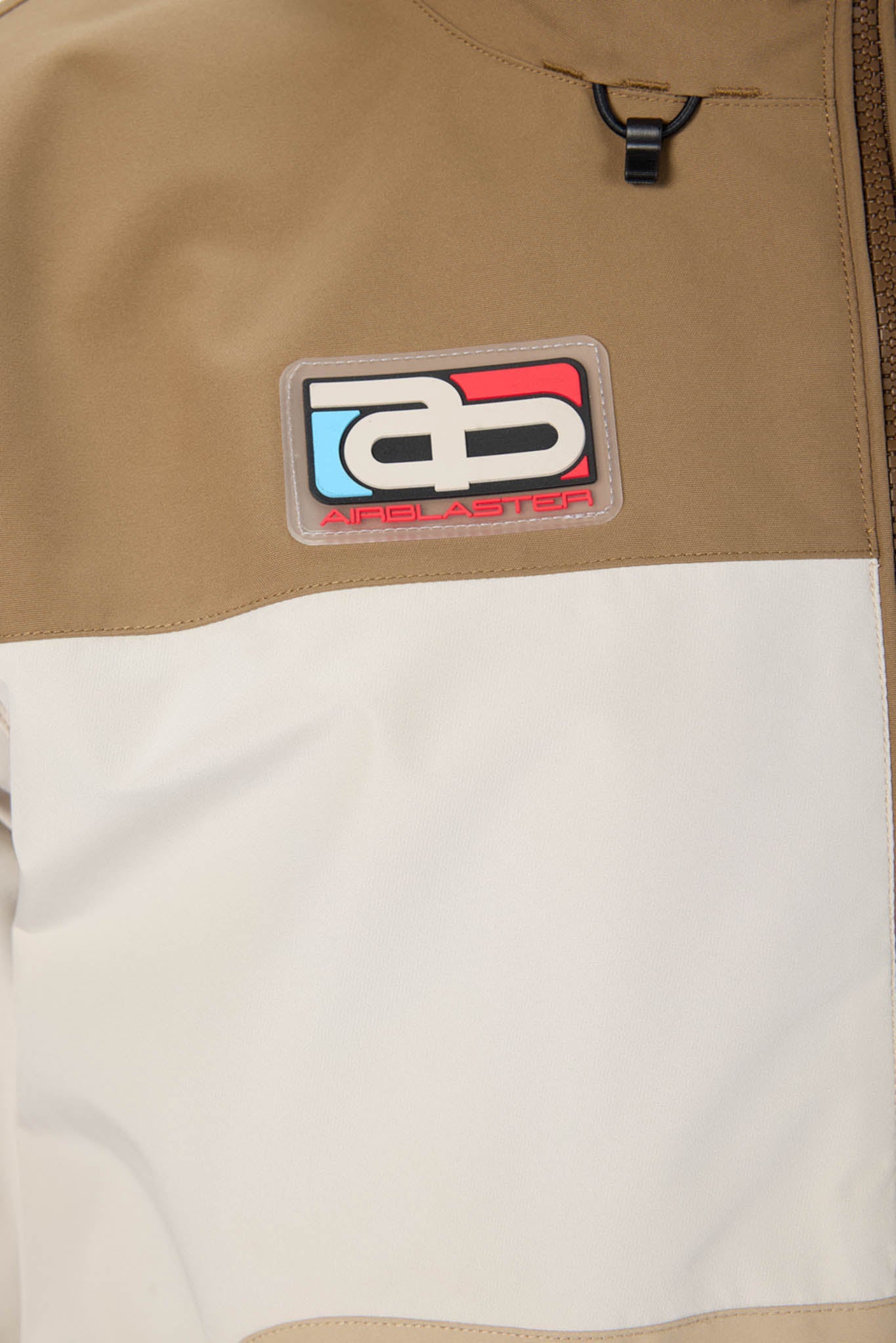 Close-up of a patch on a jacket with a brand logo.