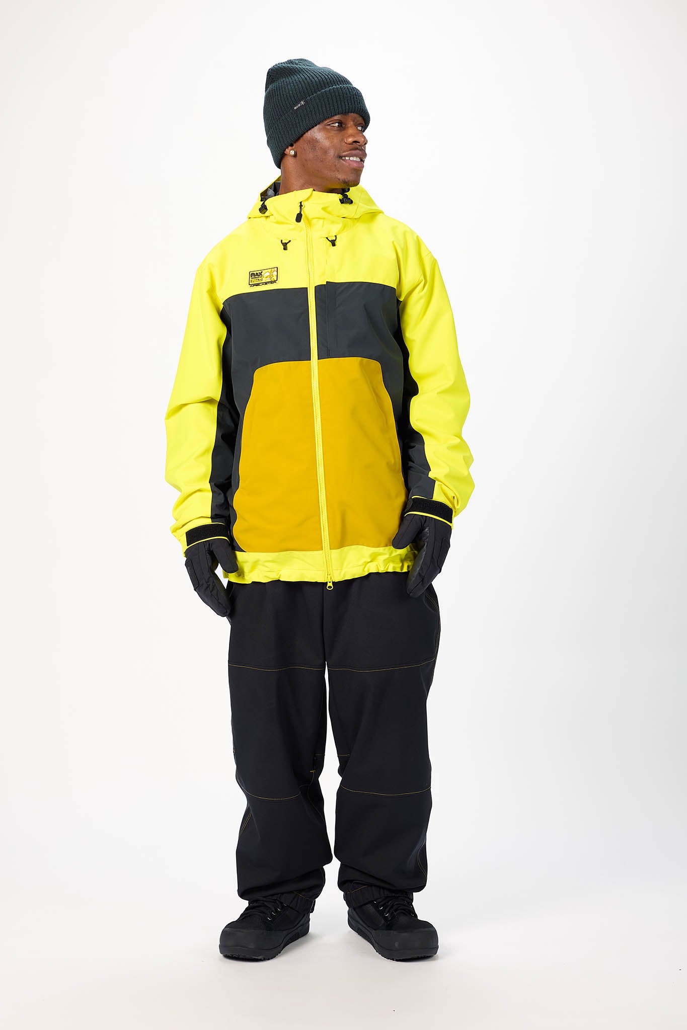 Person wearing a yellow and black raincoat with a white background