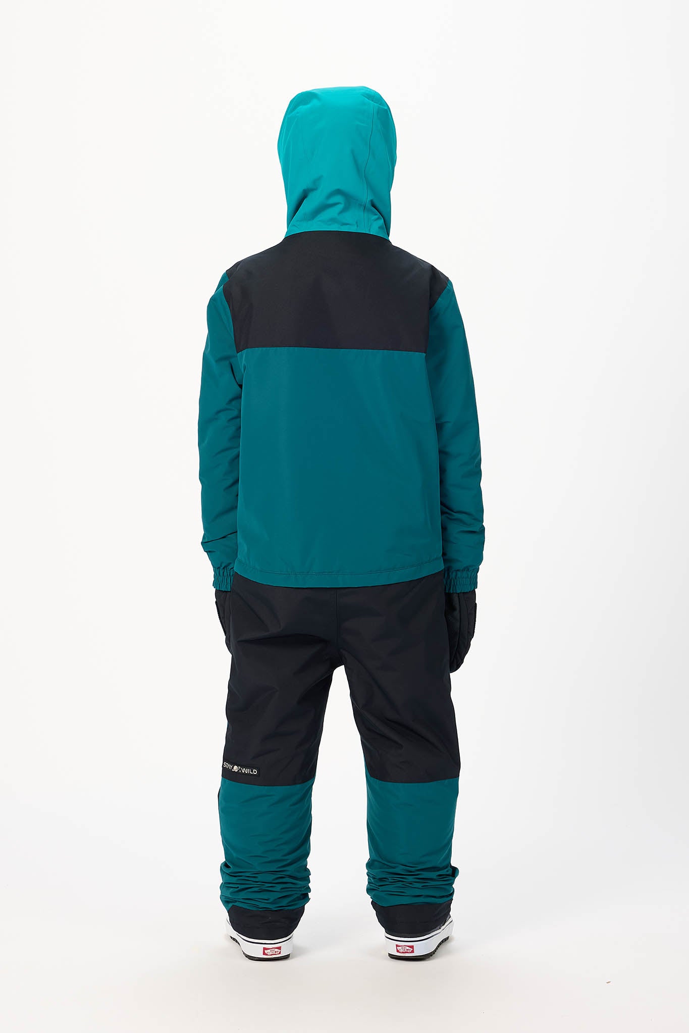 A child wearing a two-tone teal and black hooded jacket and matching pants, shown from the back against a plain white studio background.