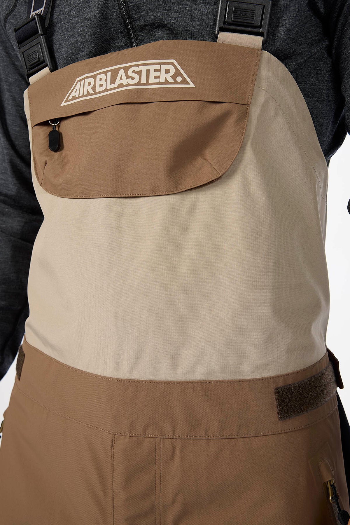 Brown and beige apron with Airblaster logo on a white background