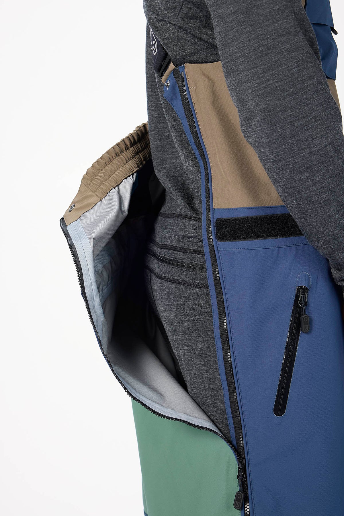 Close-up of a multicolored jacket with zippers on a white background