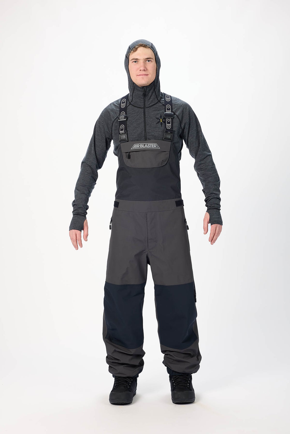 Person wearing a full-body wetsuit with a hood on a white background
