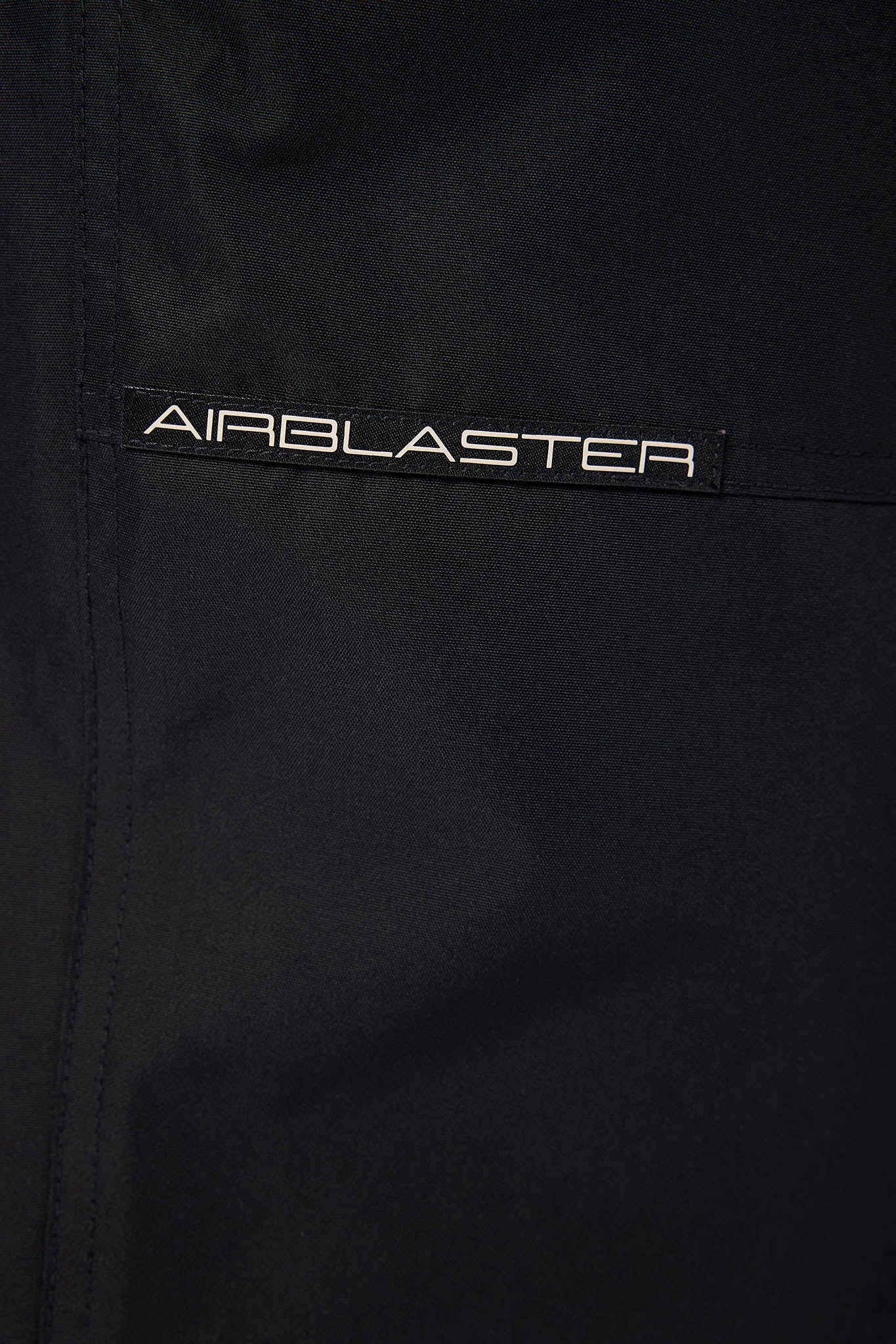 Close of black jacket airblaster logo