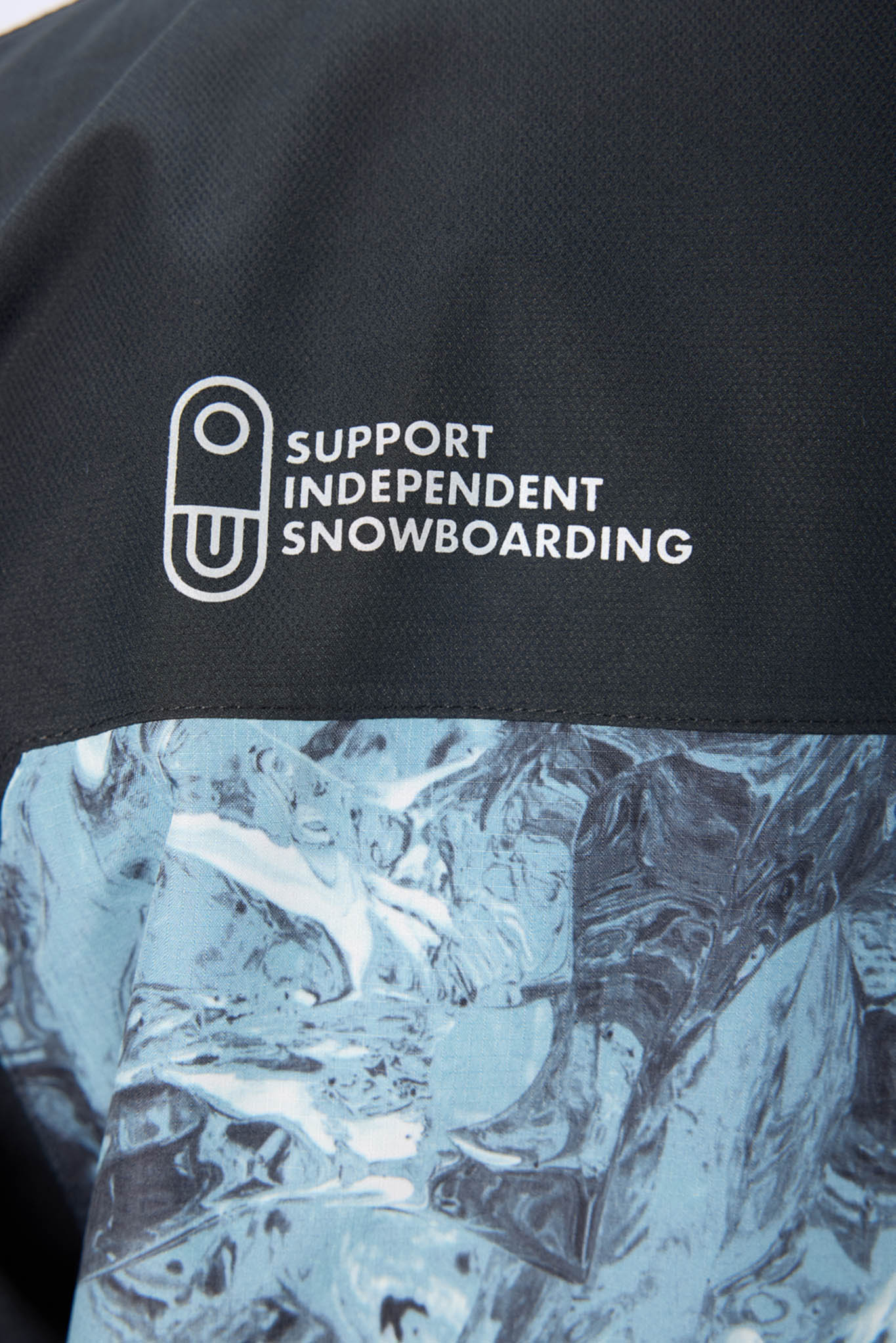 close up of blue jacket and air blaster logo