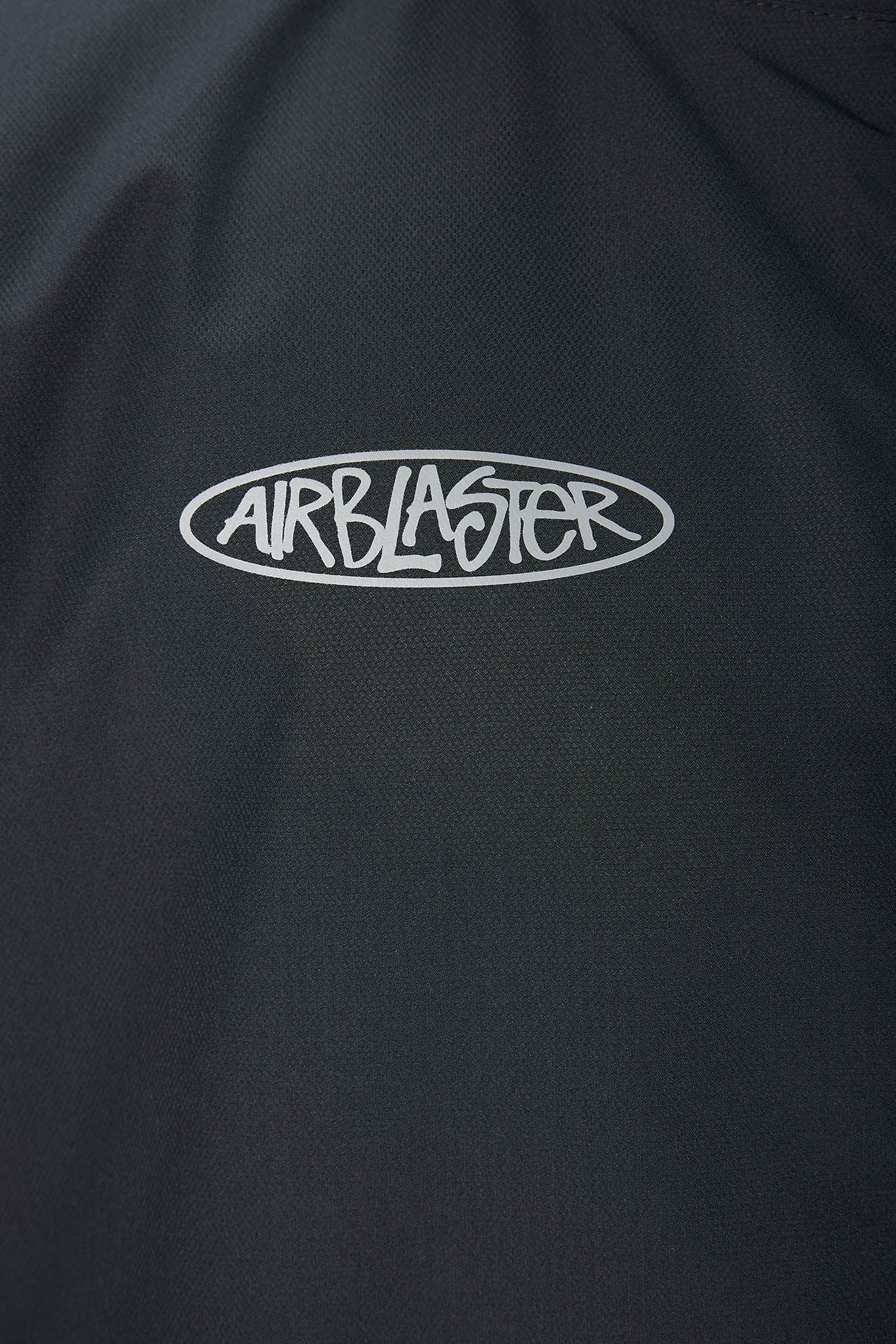 Black jacket with 'Airblaster' logo on a dark background