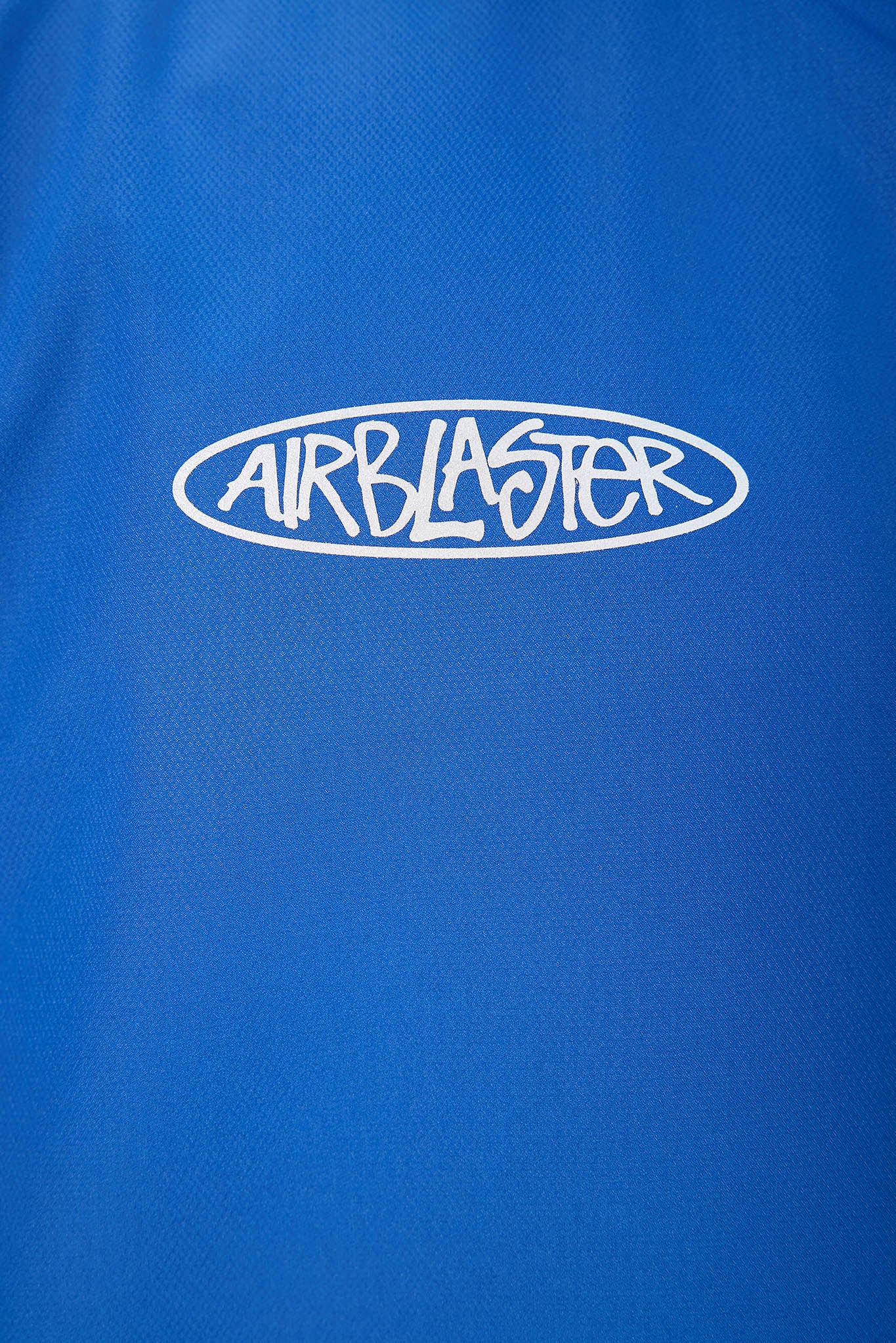 Blue jacket with 'AIRBLASTER' logo on a blue background