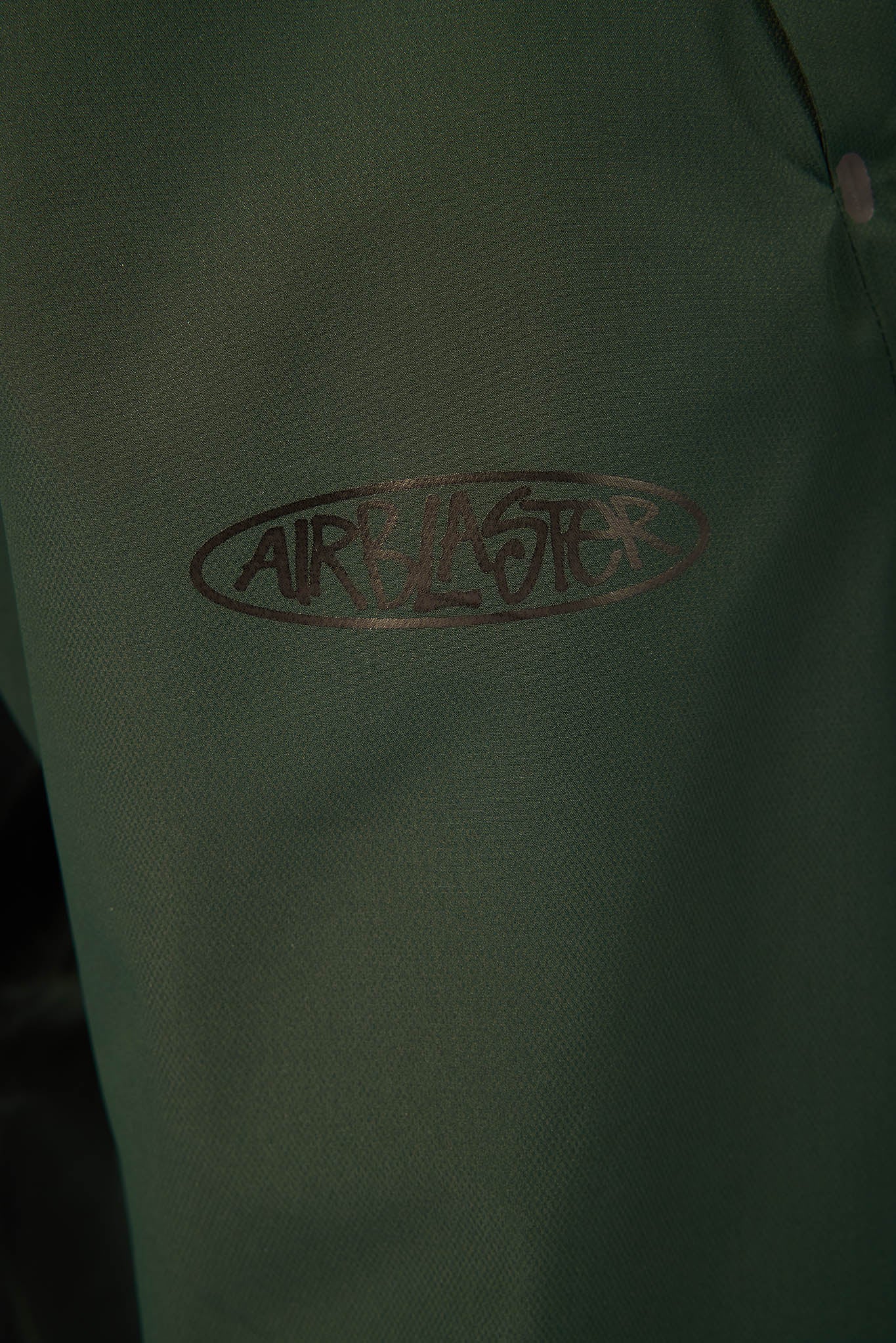 Green jacket with 'AIR MASTER' logo on a dark background