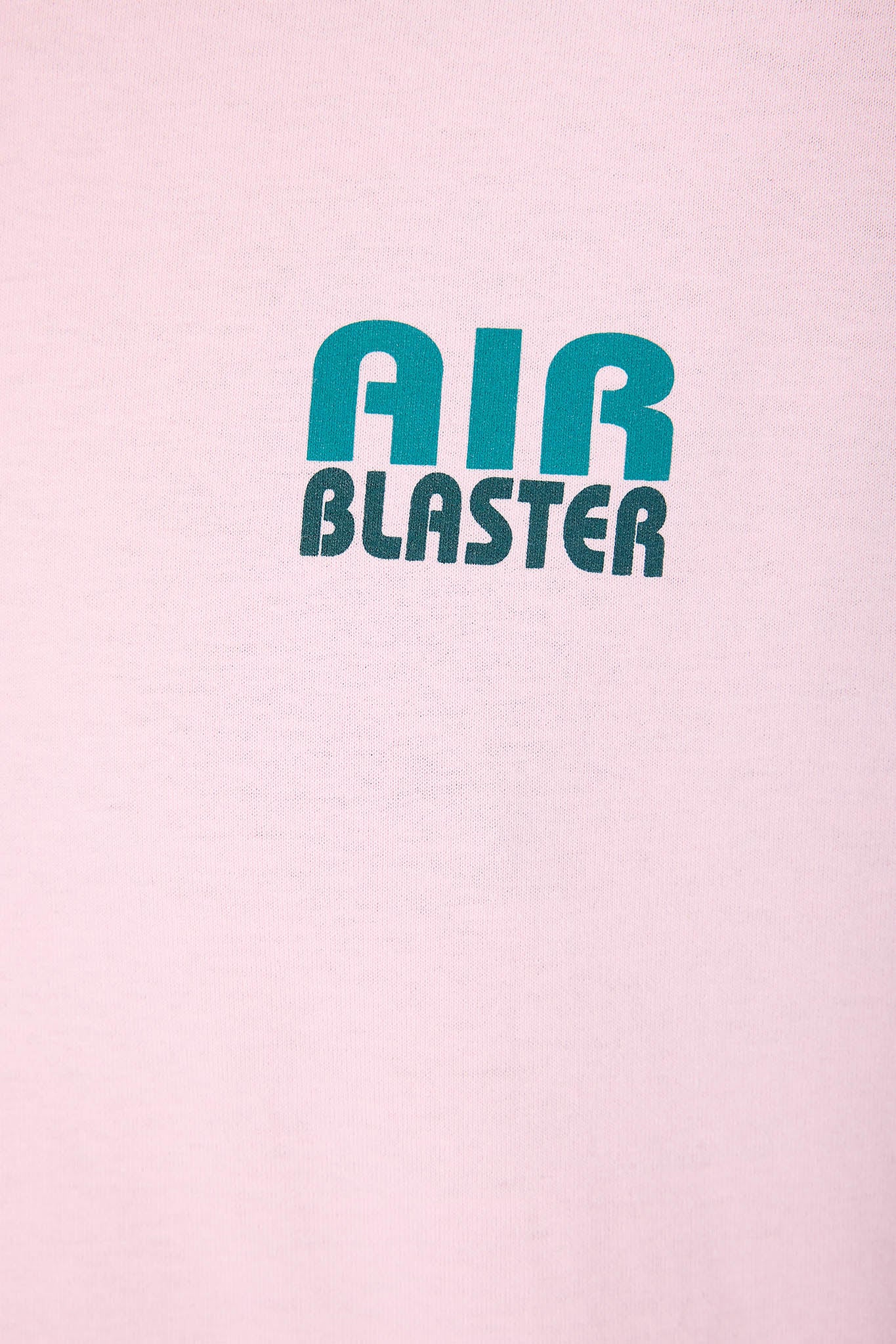 close up on a pink shirt with a teal Air logo