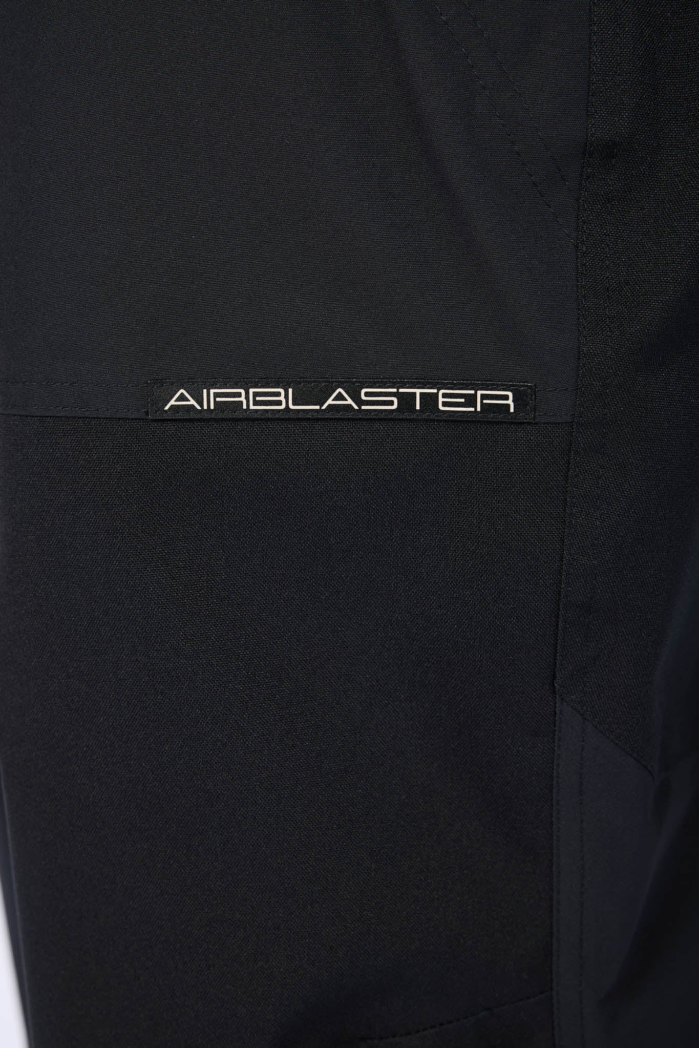 Black jacket with 'AIRBLASTER' logo on a black background