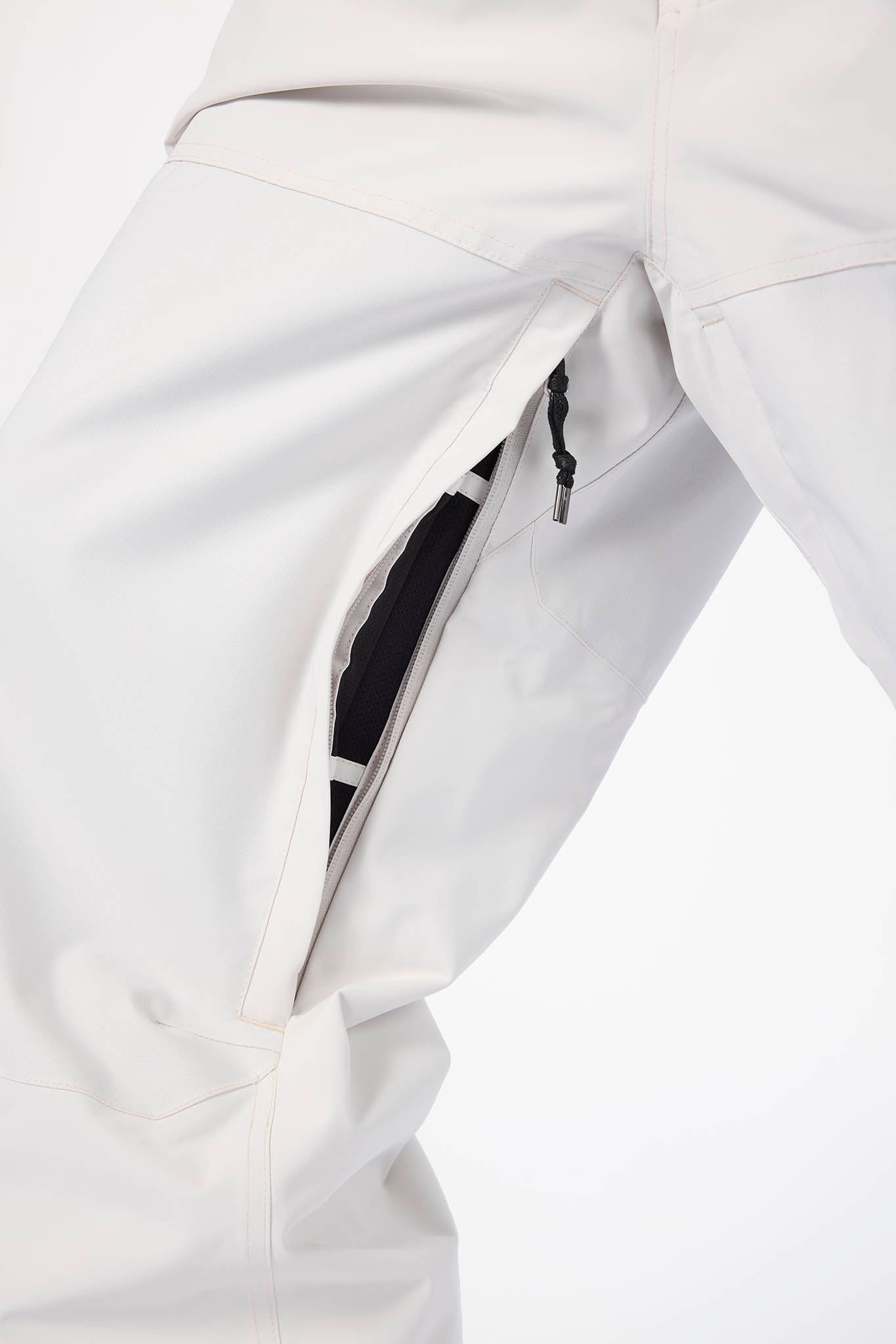 Close-up of a white jacket with a zipper pocket on a light gray background