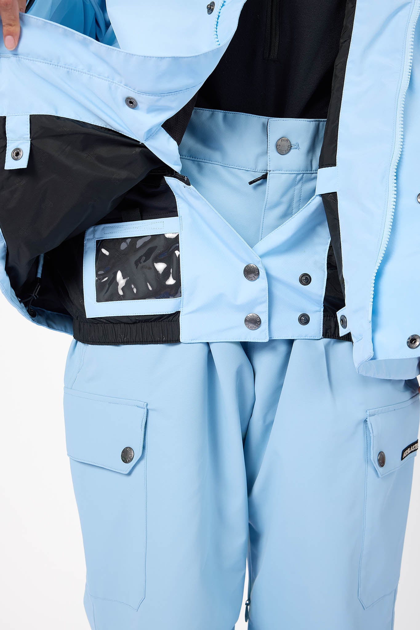 Light blue snowsuit with black accents on a neutral background