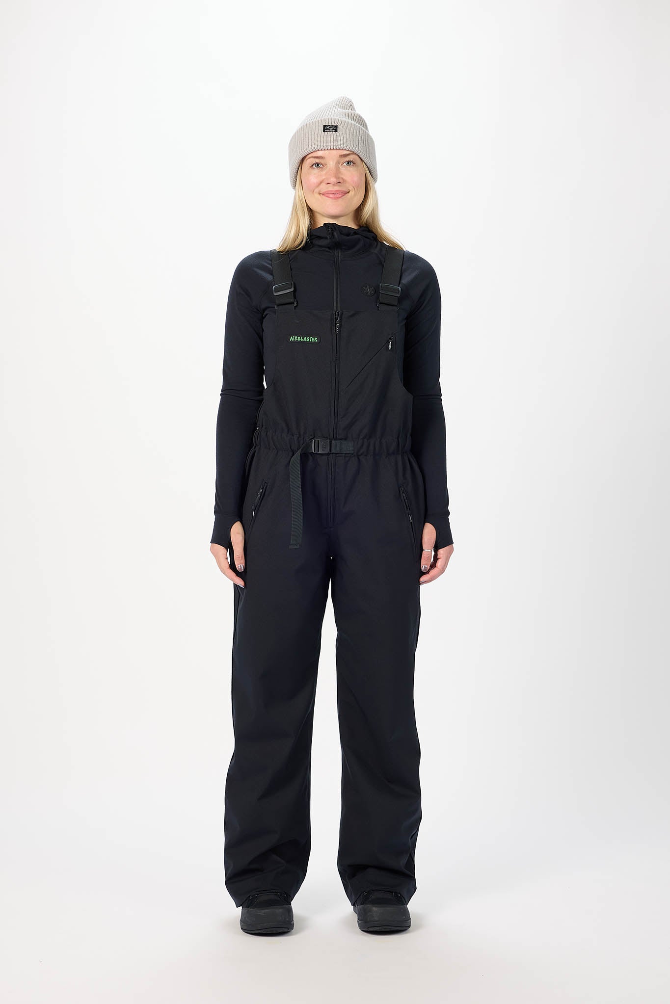 Person wearing a black snowsuit and gray beanie on a white background