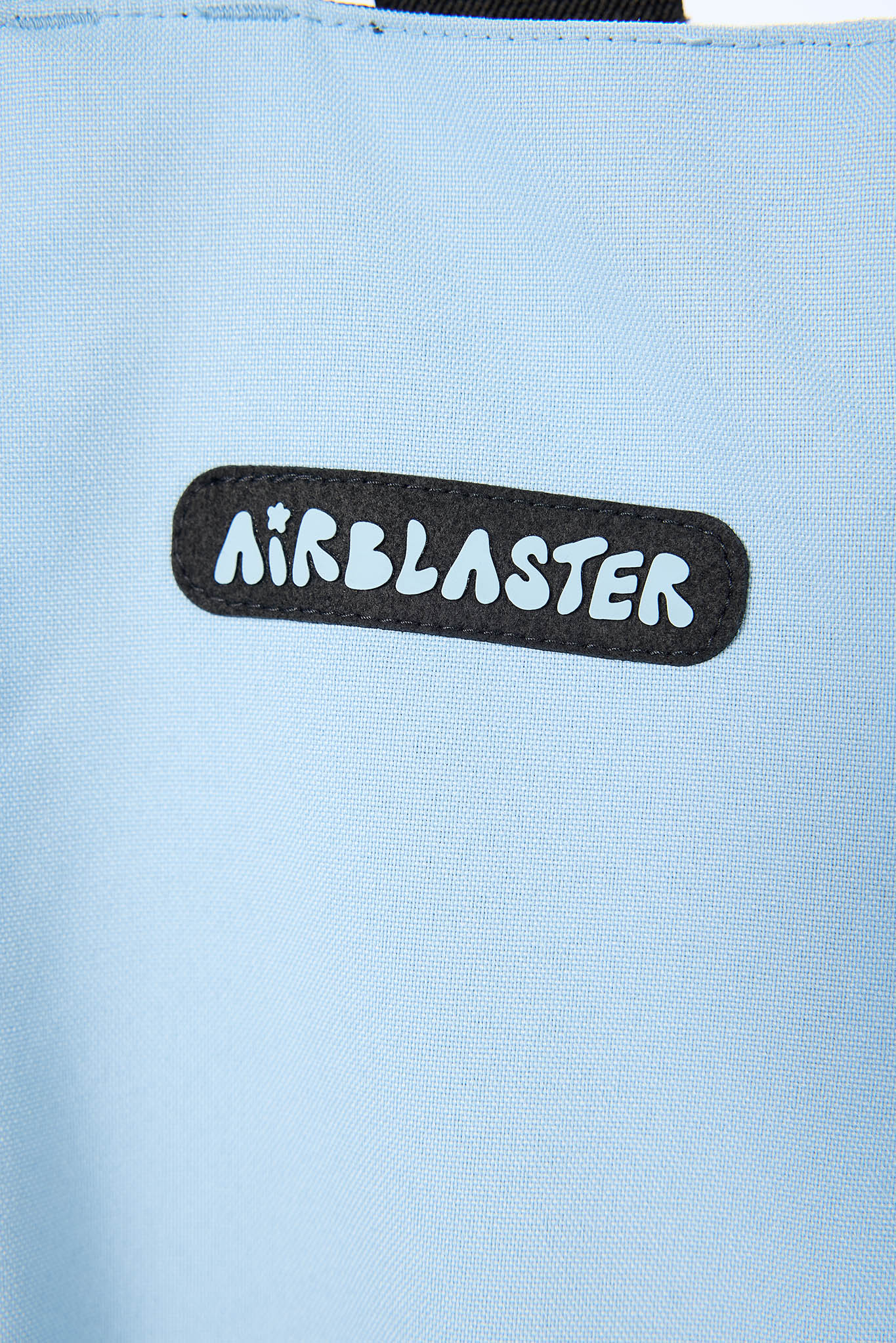 Light blue bag with 'Airblaster' logo on a light blue background