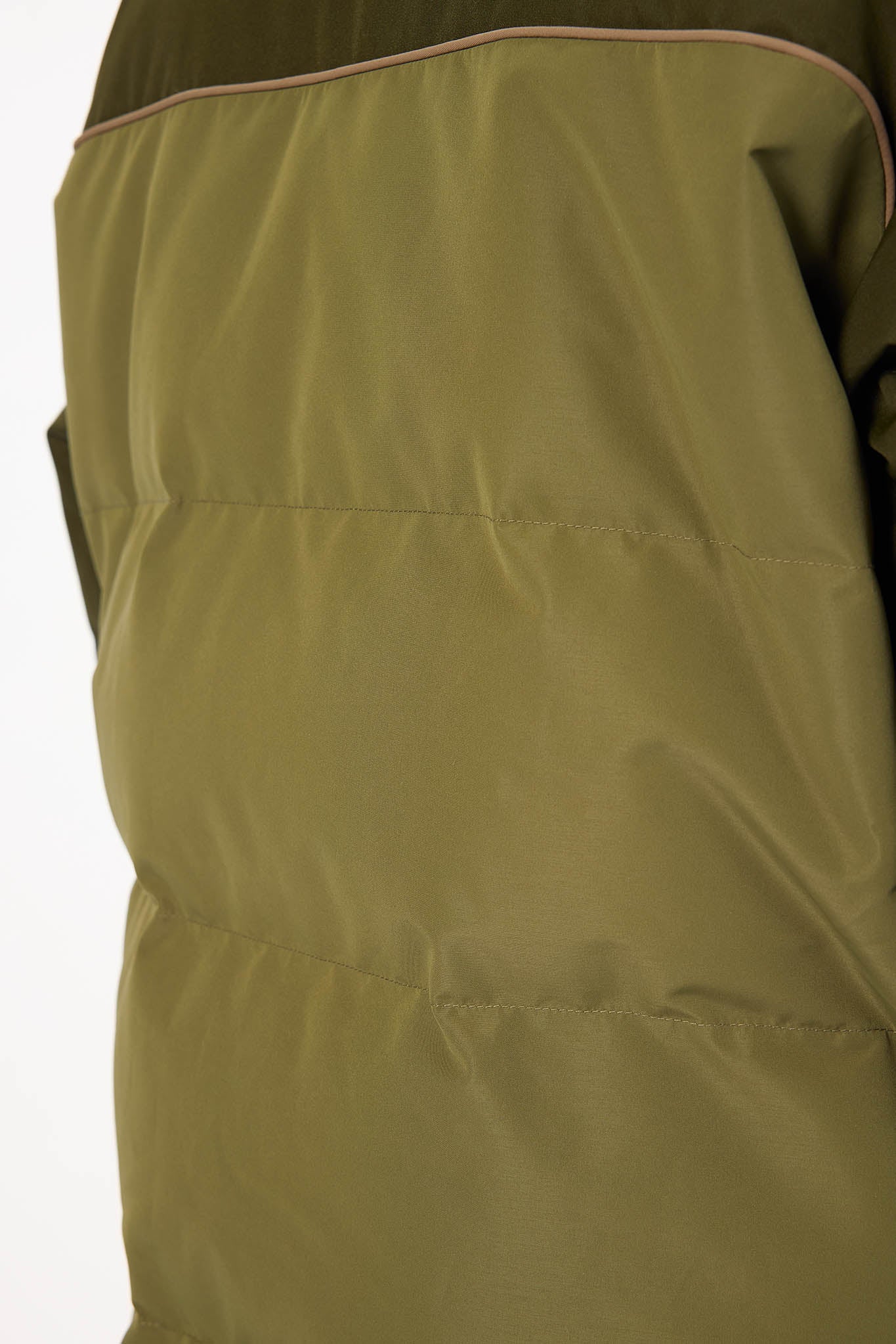Close-up of a green jacket with a white background