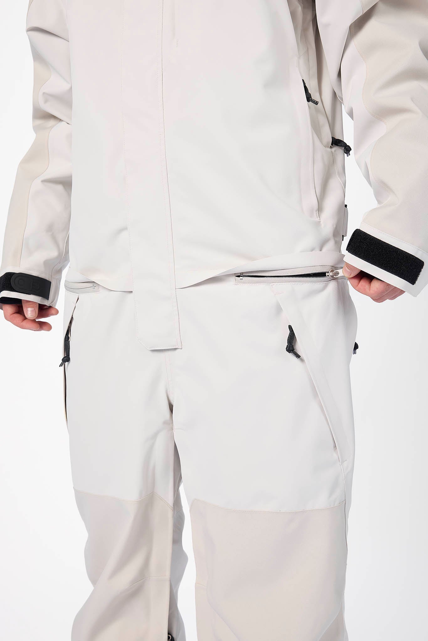 White snowsuit with black accents on a white background
