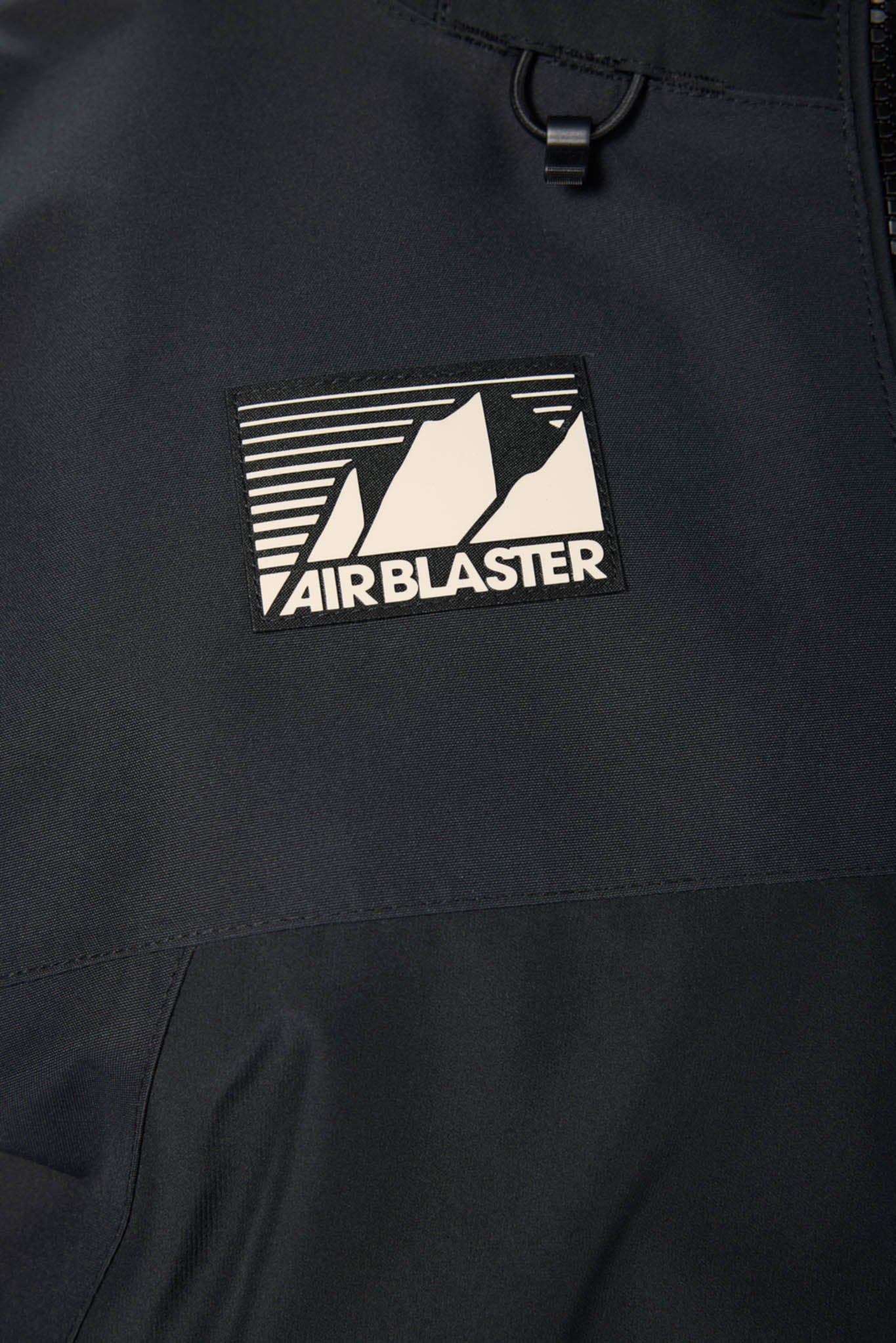 Black jacket with Airblaster logo on a black background